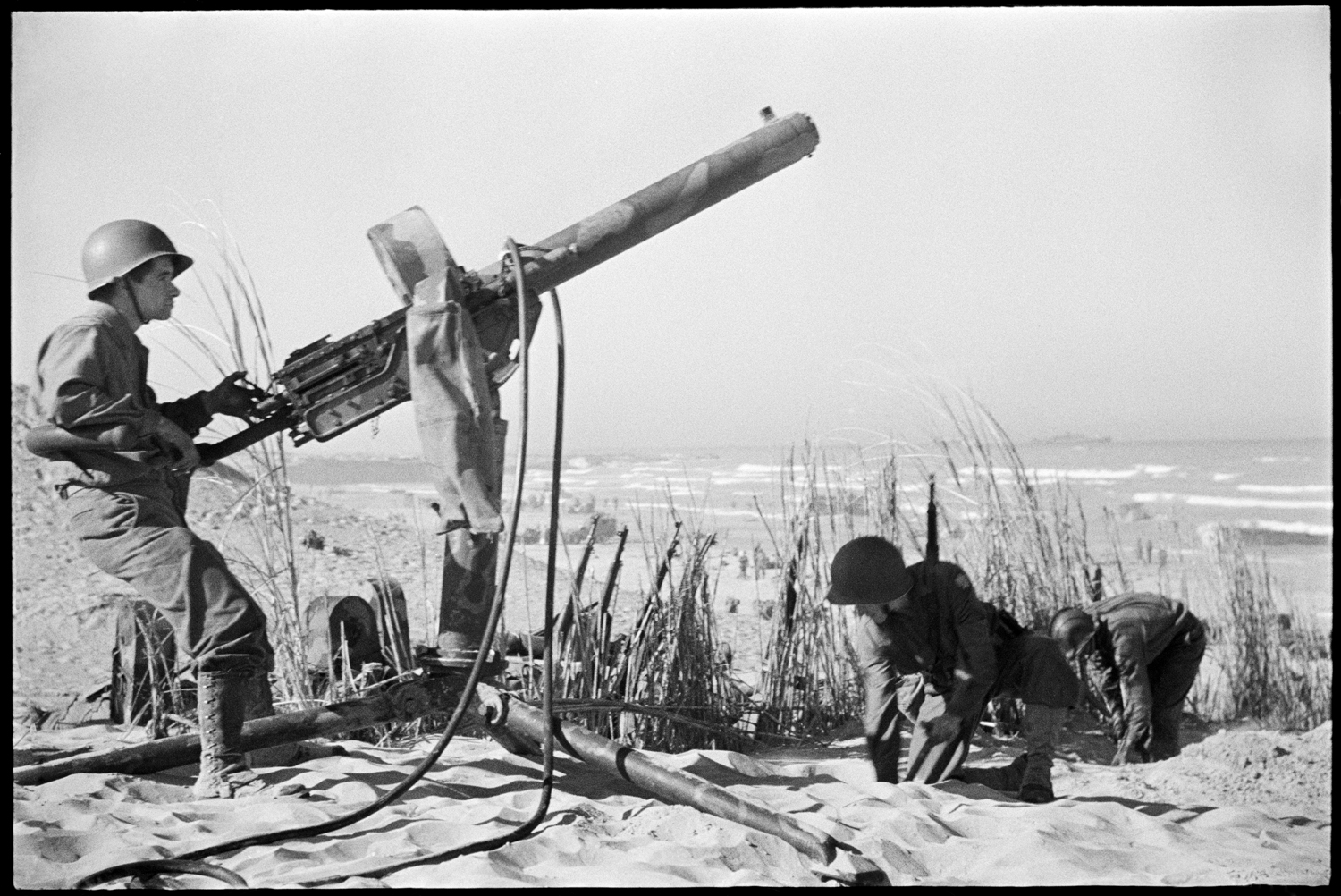 U.S. Army Ranger manning anti-aircraft gun, Sicily, 1943.