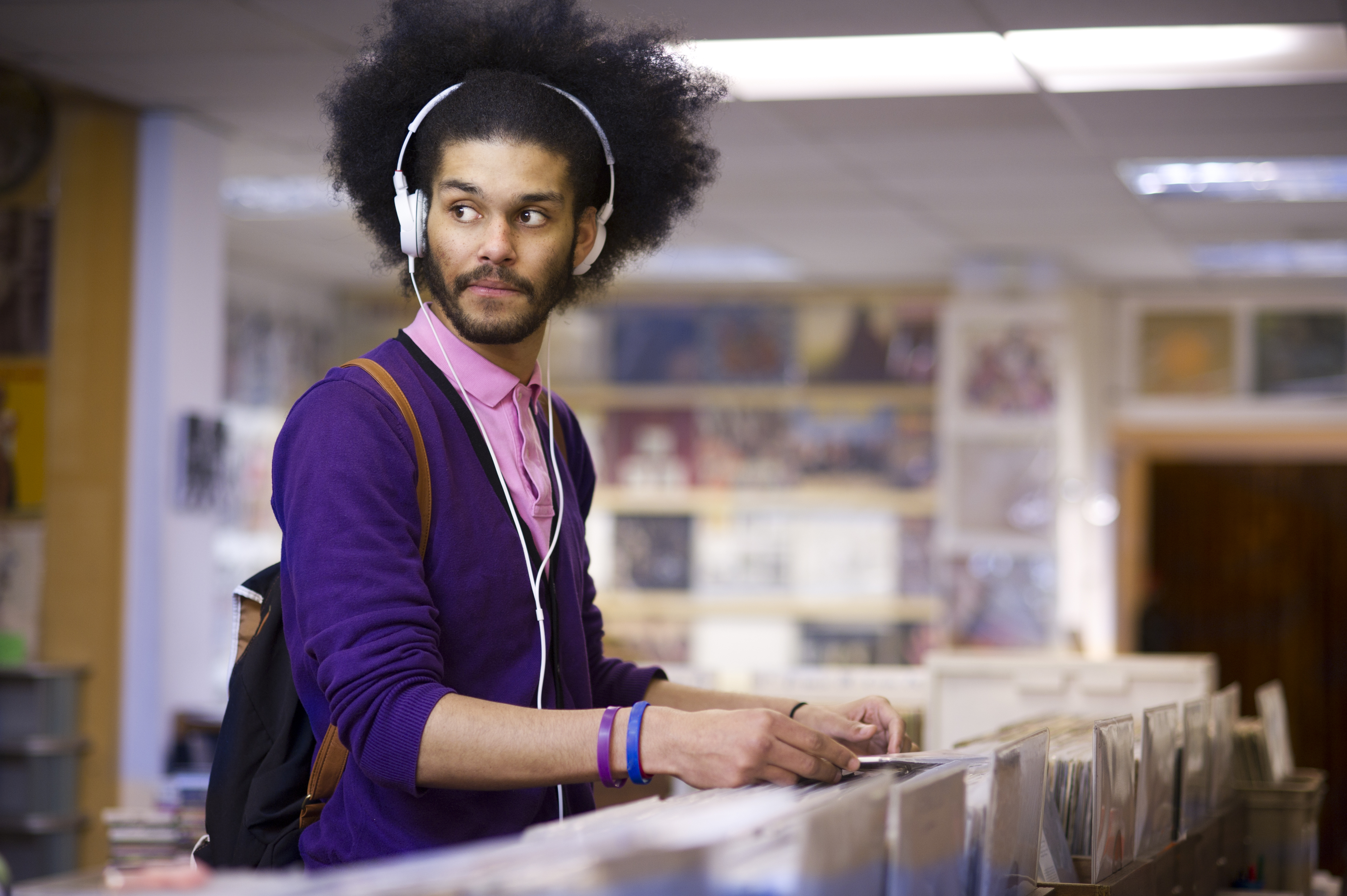 Hipster in record store