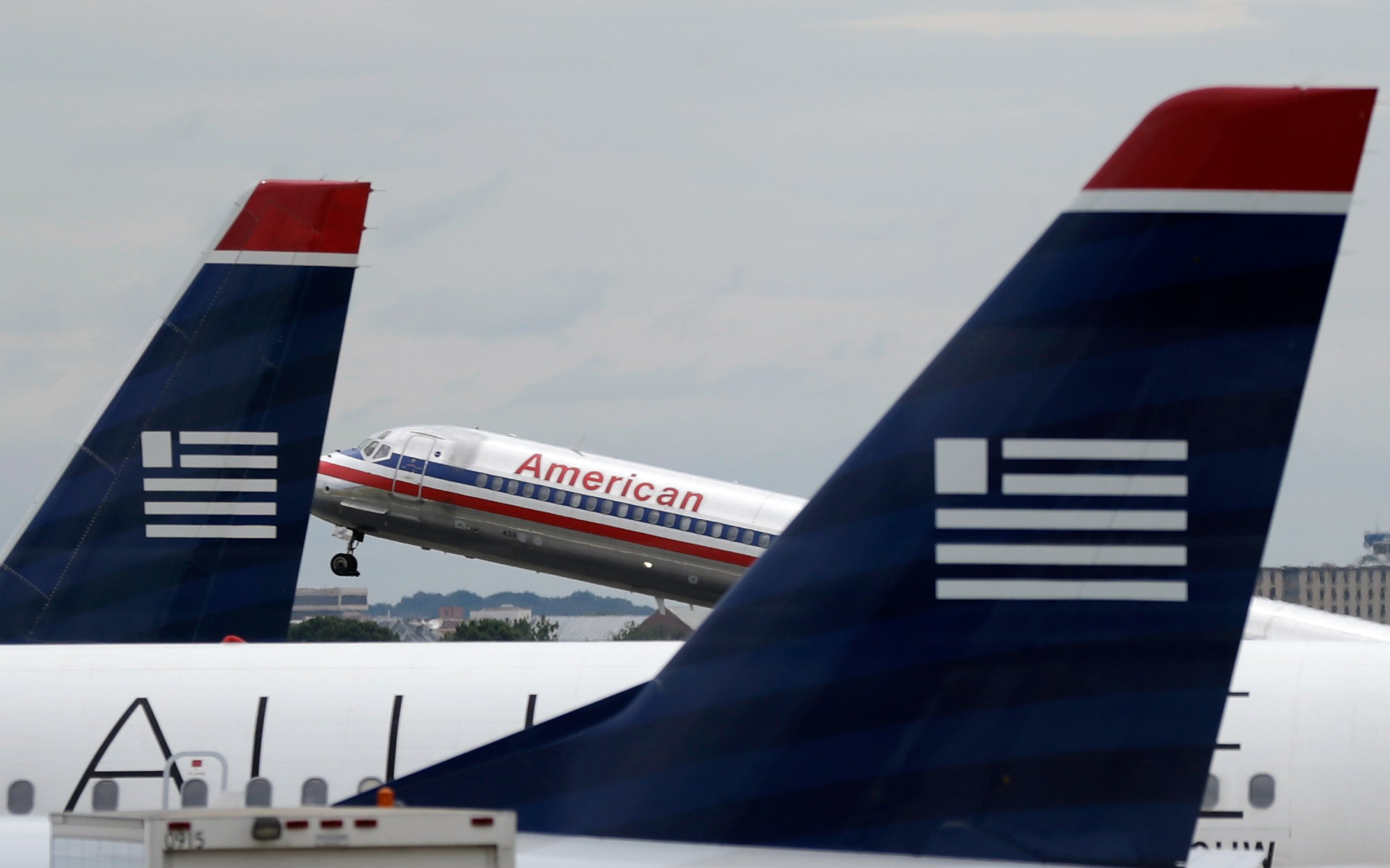 Justice Department Files Suit To Block Proposed Merger Of American and US Airways