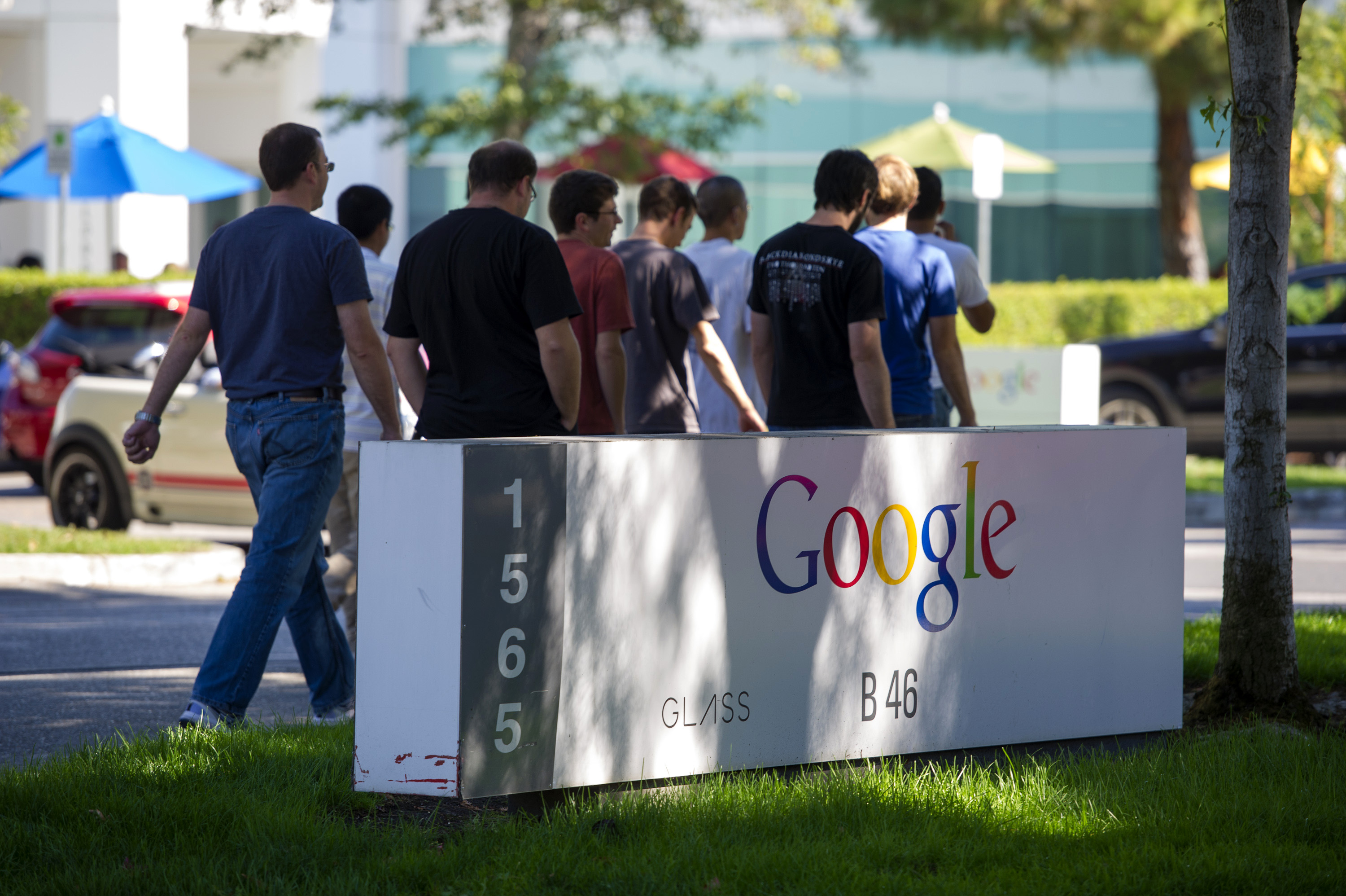 Pedestrians walk past Google Inc. signage displayed in front of the company's headquarters in Mountain View, California, U.S., on Friday, Sept. 27, 2013. (David Paul Morris—Bloomberg / Getty Images)