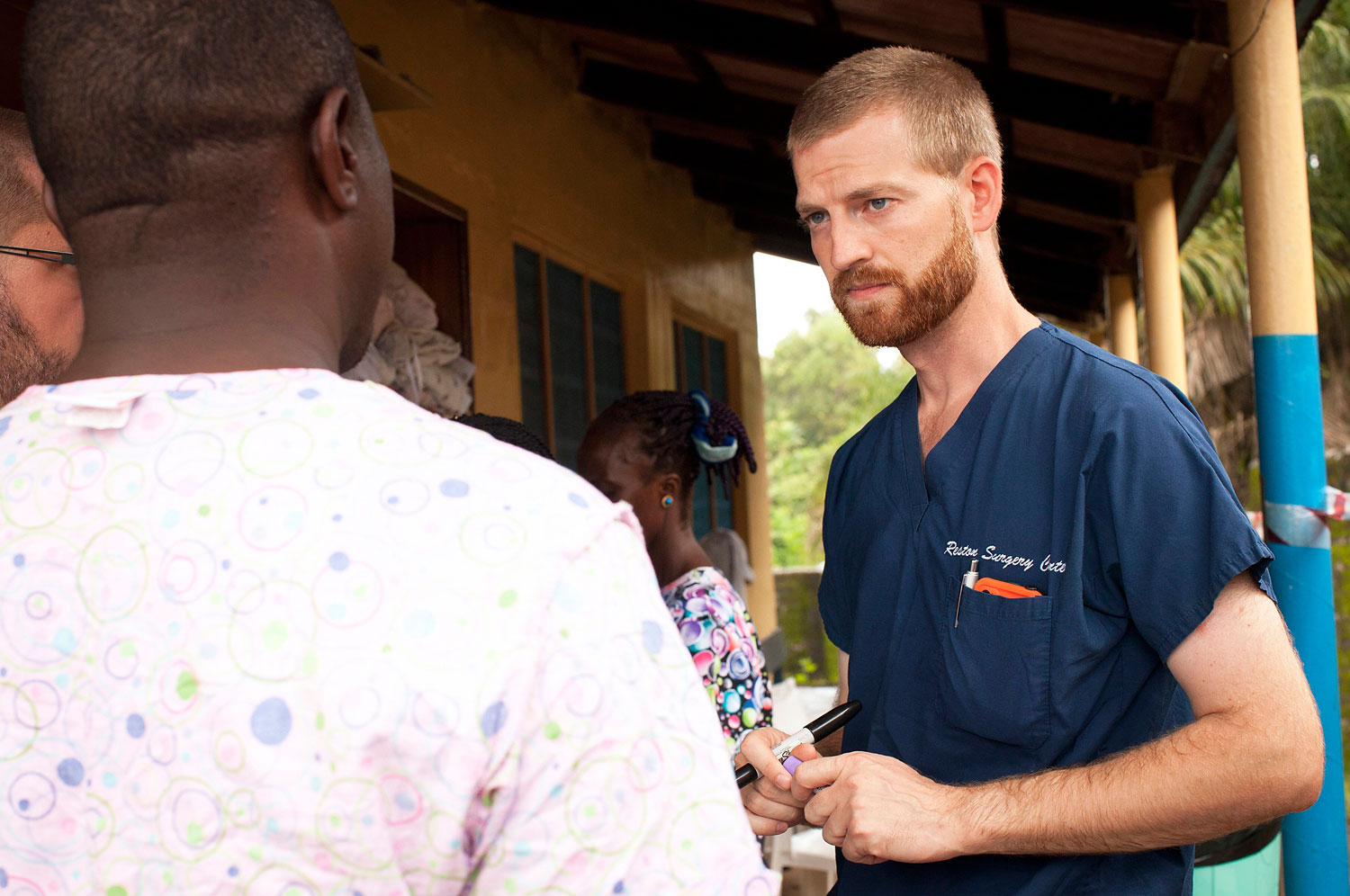 In an undated handout photograph courtesy of Samaritan's Purse, Dr. Kent Brantly, right,  with colleagues at the case management center on the campus of ELWA Hospital in Monrovia, Liberia. Brantly, who  contracted Ebola, is receiving treatment at Emory University Hospital in Atlanta (Samaritan&#039;s Purse/Reuters)