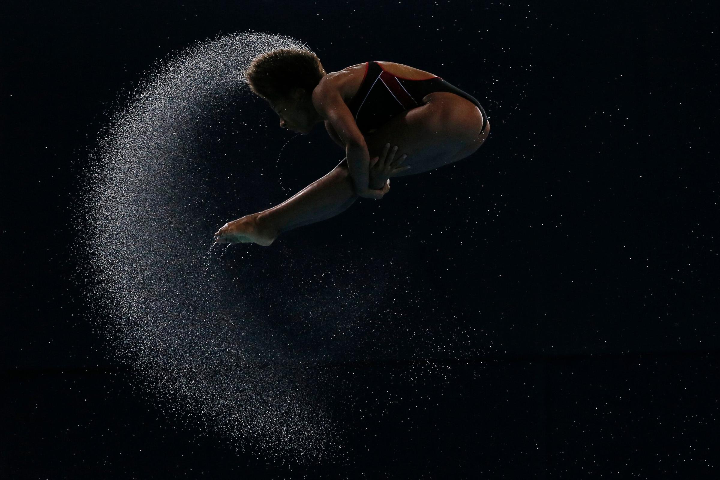 Abel of Canada dives during the women's 3m Springboard final at the 2014 Commonwealth Games in Edinburgh