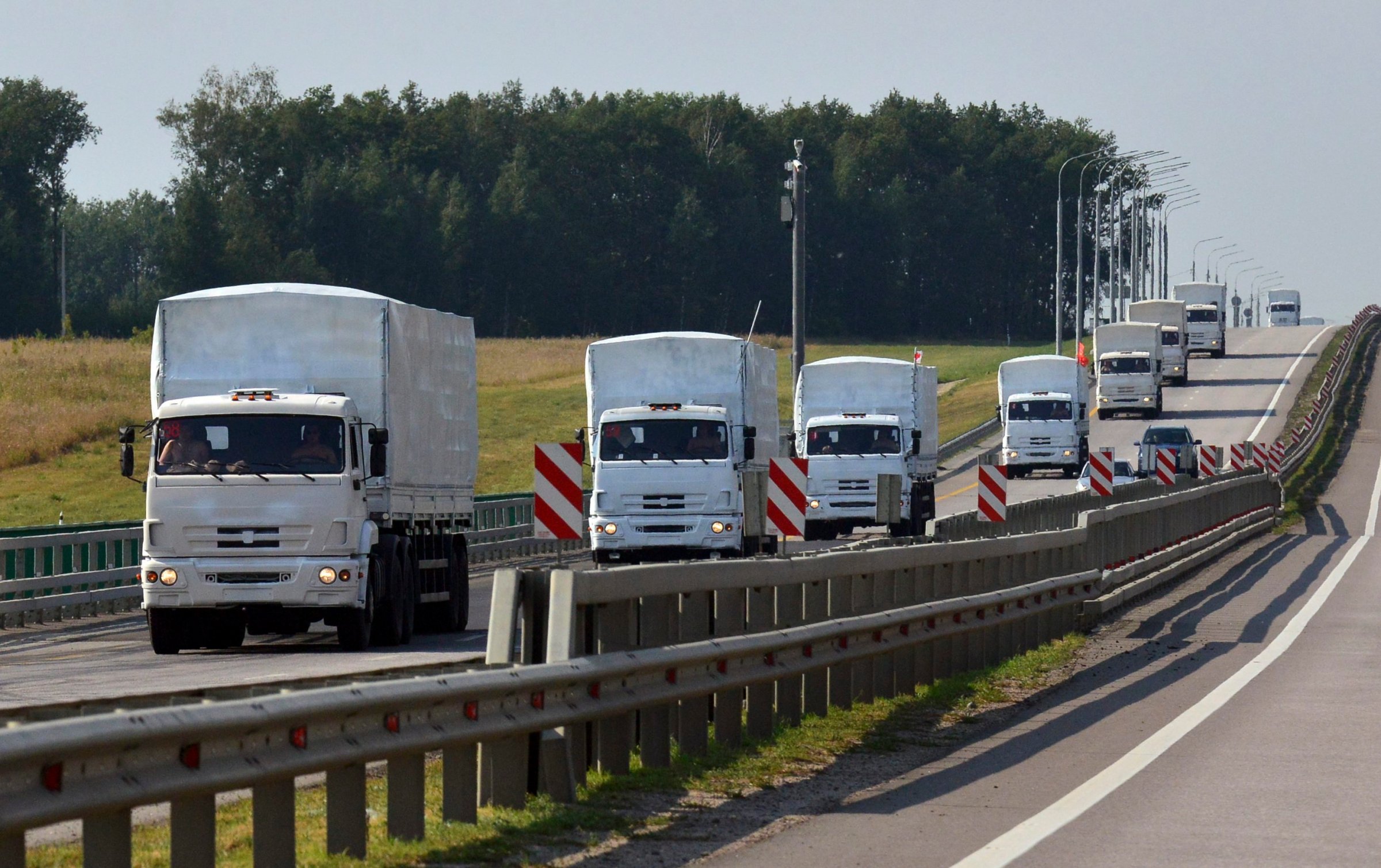 A Russian convoy of trucks carrying humanitarian aid for Ukraine drives along a road near the city of Yelets August 12, 2014.
