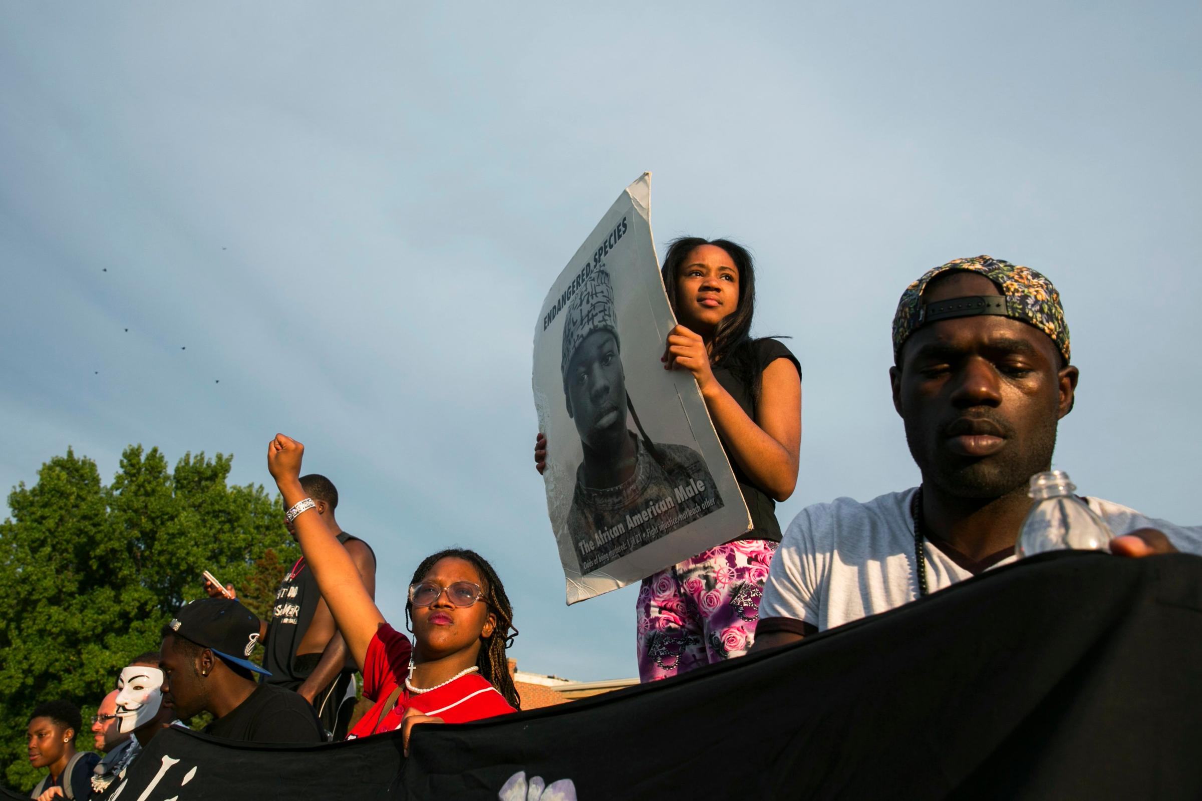 Demonstrators protest outside of Greater St. Marks Family Church in Ferguson, Missouri