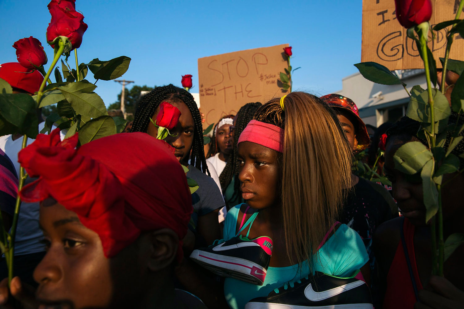 Demonstrators march down West Florissant during a peaceful march in reaction to the shooting of Michael Brown, near Ferguson, Missouri