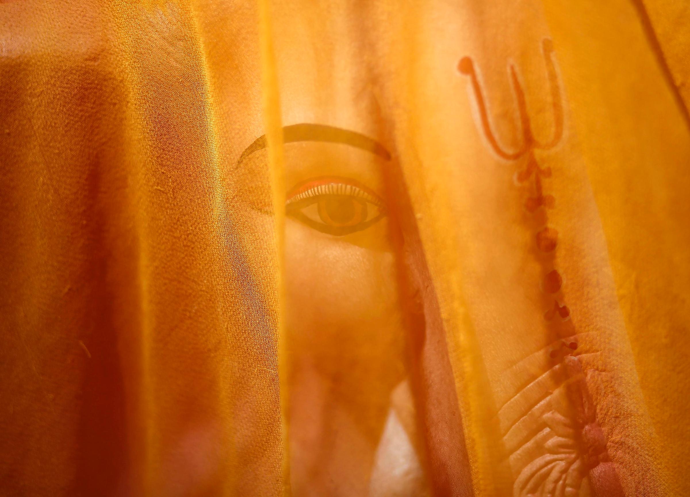 A cloth covered idol of Hindu elephant god Ganesh is pictured at a roadside workshop in New Delhi