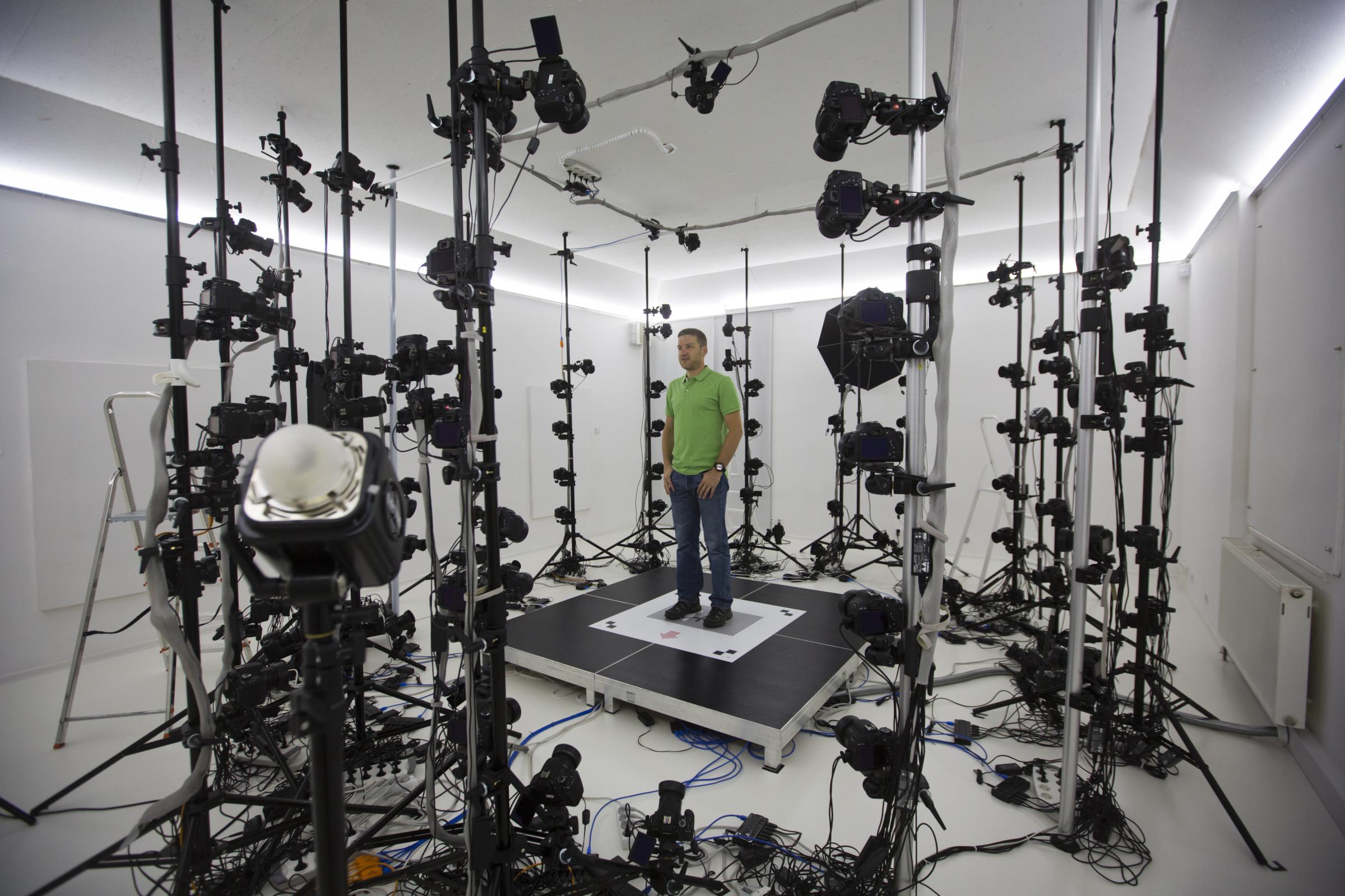 Martin Benes from 3D gang company demonstrates one of the stages of 3D scanning on August 26, 2014 in Prague, Czech Republic. The 3D scanner is the largest in continental Europe, with 115 sensors, and is designed to scan objects, people and animals.