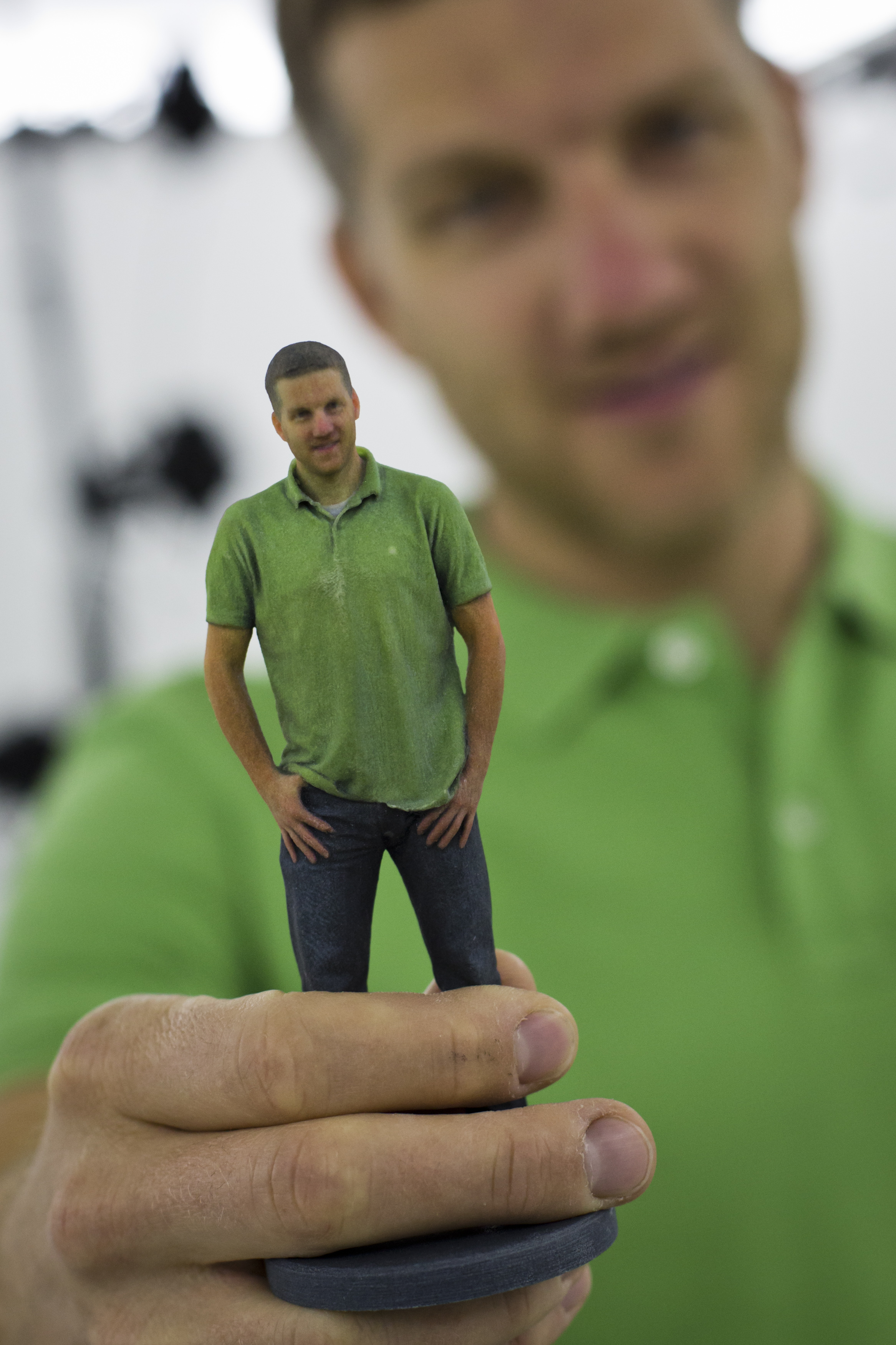 Martin Benes from 3D gang company holds a printed figurine of himself on August 26, 2014 in Prague, Czech Republic.