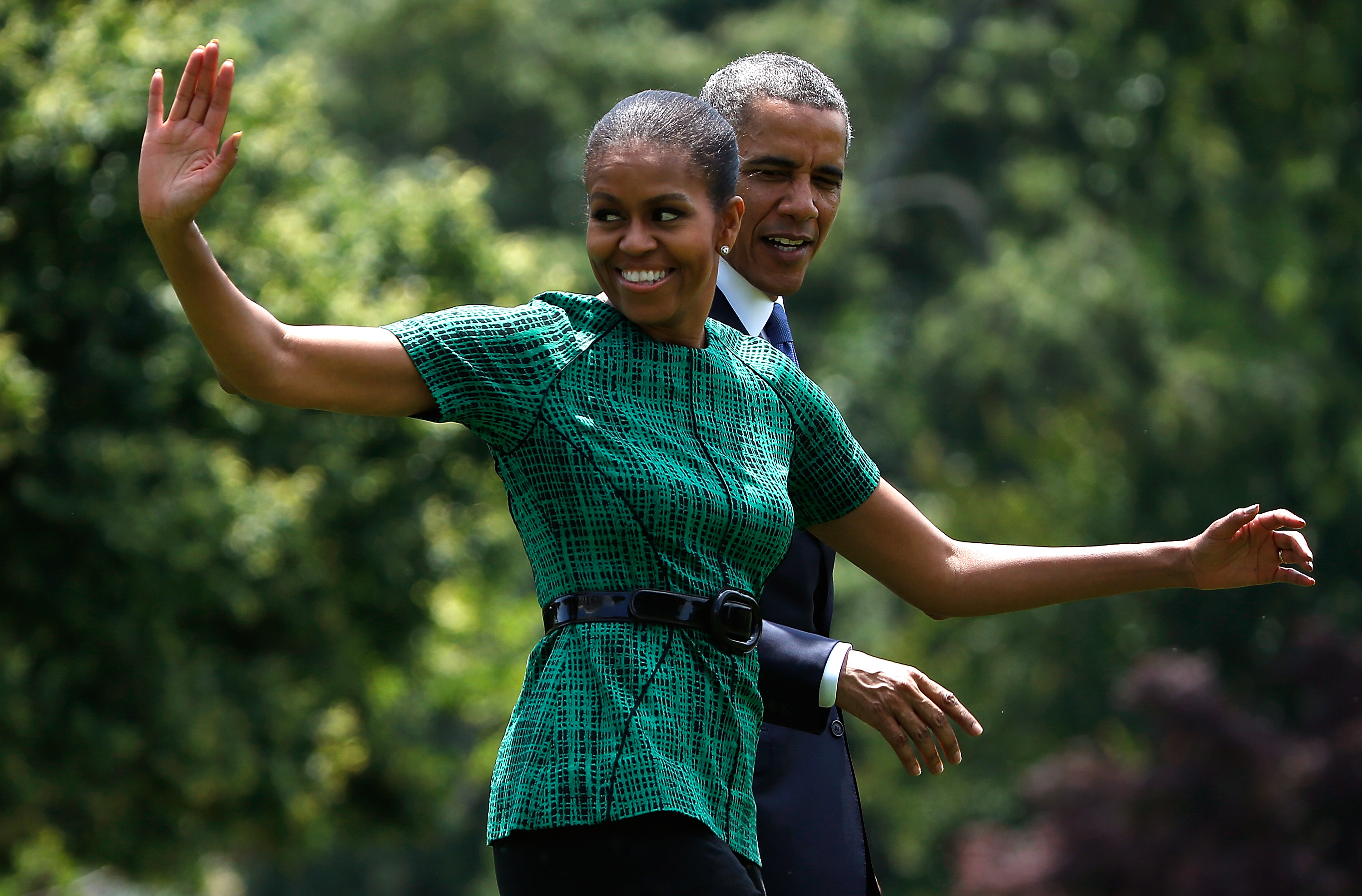 First lady Michelle Obama and U.S. President Barack Obama wave (Win McNamee—Getty Images)