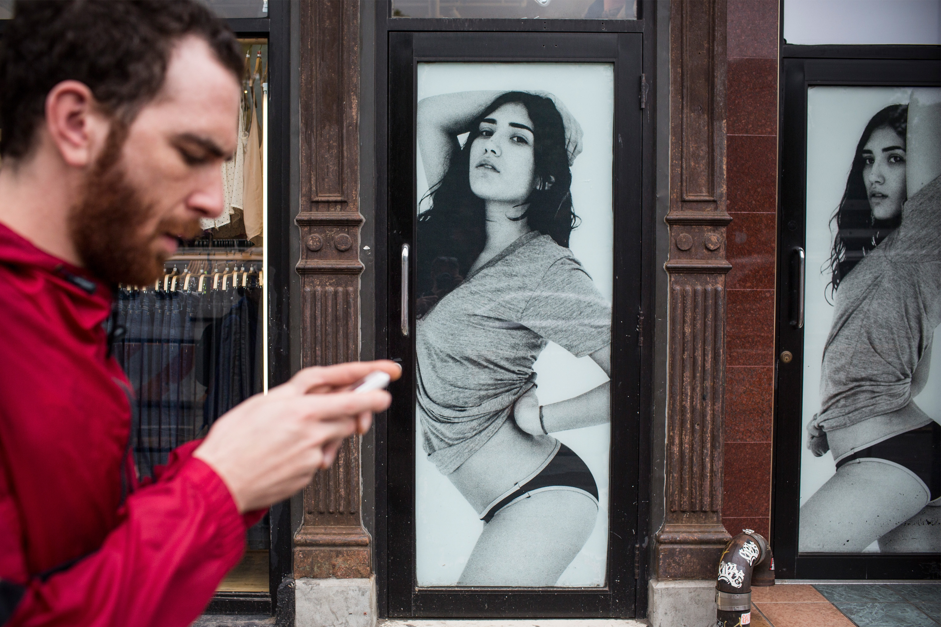 A man walks past an American Apparel store on June 19, 2014 in New York City. (Andrew Burton&mdash;Getty Images)