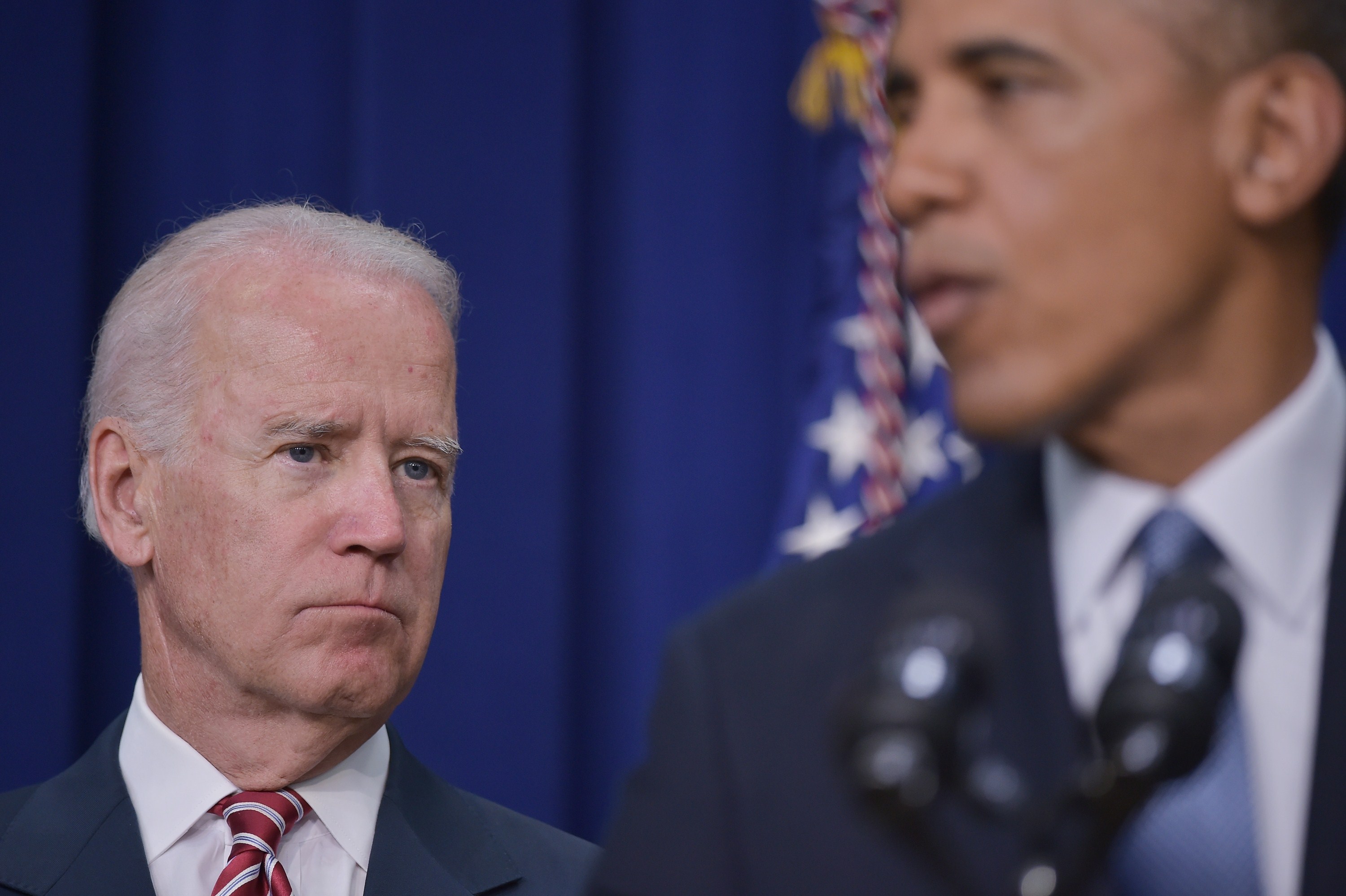 Vice President Joe Biden watches as President Barack Obama speaks during a signing ceremony for H.R. 803, the Workforce Innovation and Opportunity Act, on July 22, 2014 in the South Court Auditorium of the Eisenhower Executive Office Building, next to the White House in Washington, DC. (MANDEL NGAN&mdash;AFP/Getty Images)