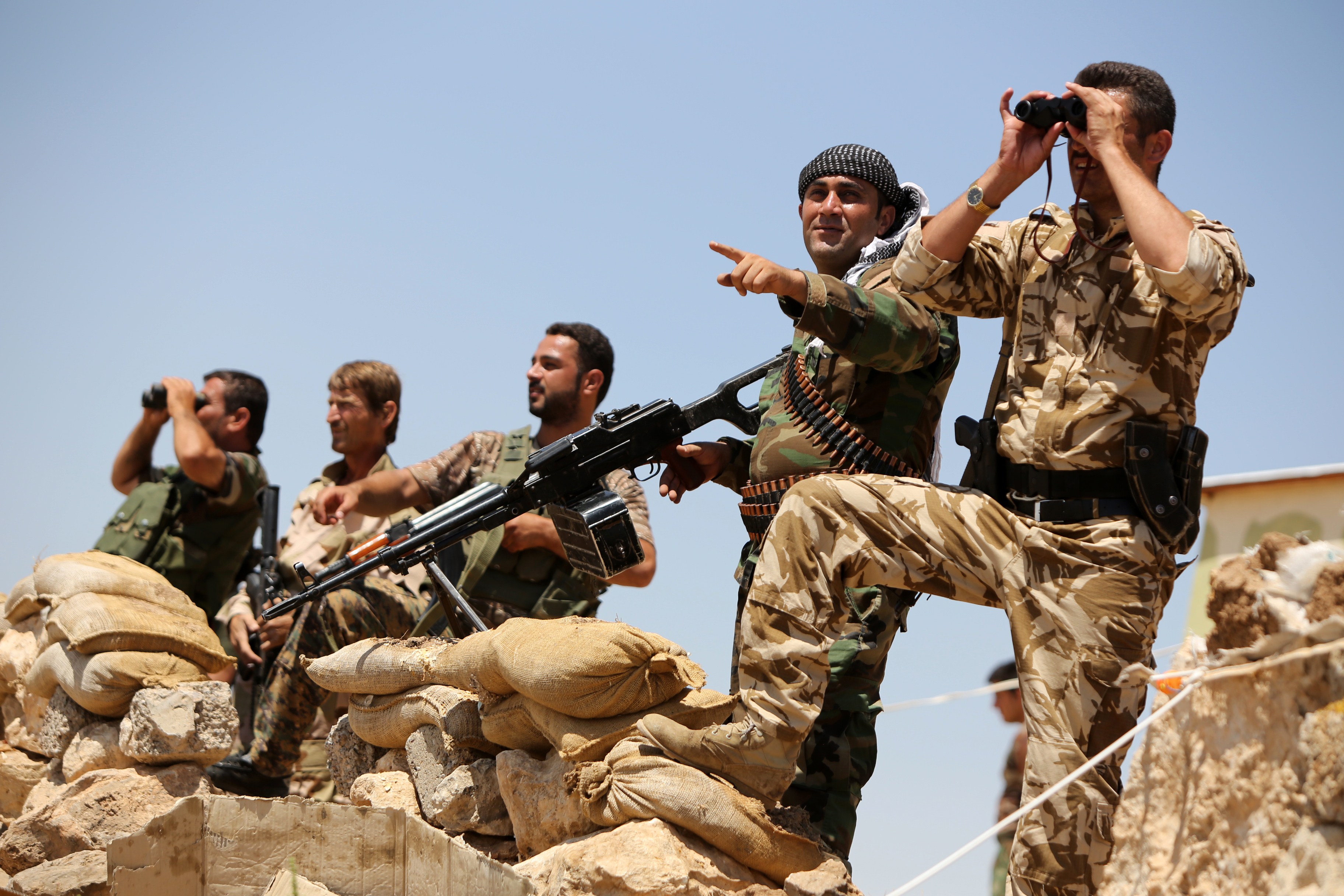 Iraqi Kurdish Peshmerga fighters take positions in northern Iraq on Tuesday. (AHMAD AL-RUBAYE / AFP / Getty Images)