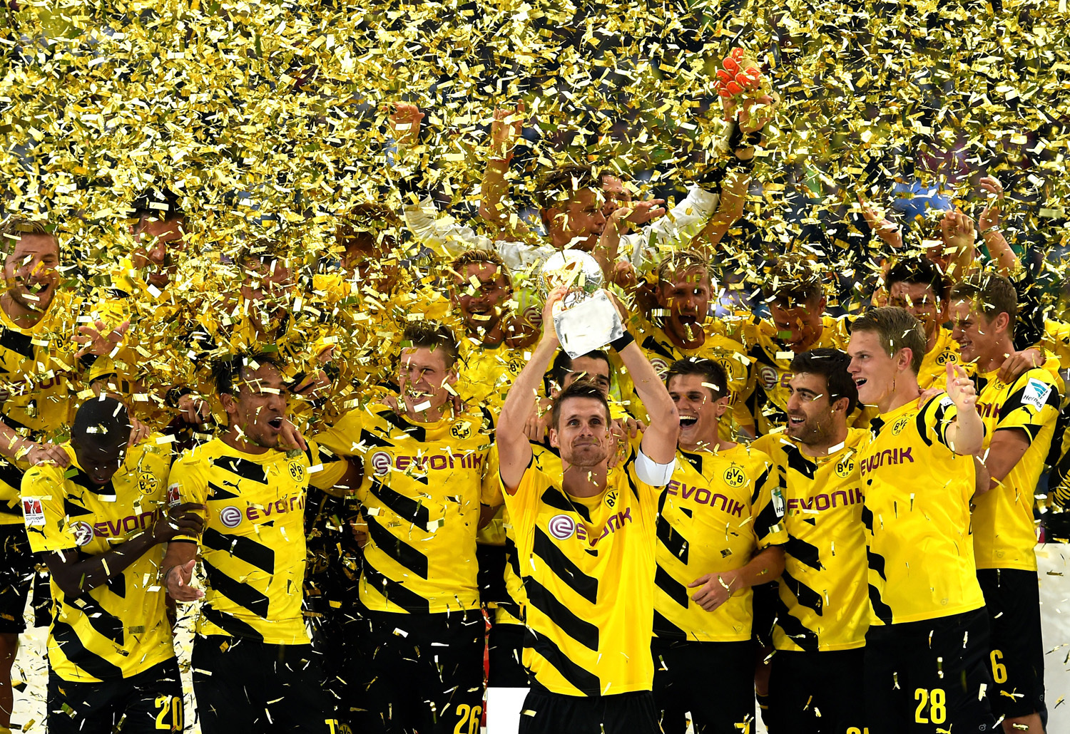 Dortmund captain Sebastian Kehl lifts the trophy following his team's 2-0 victory during the DFL Supercup between Borrussia Dortmund and FC Bayern Muenchen at Signal Iduna Park on August 13, 2014 in Dortmund, Germany.