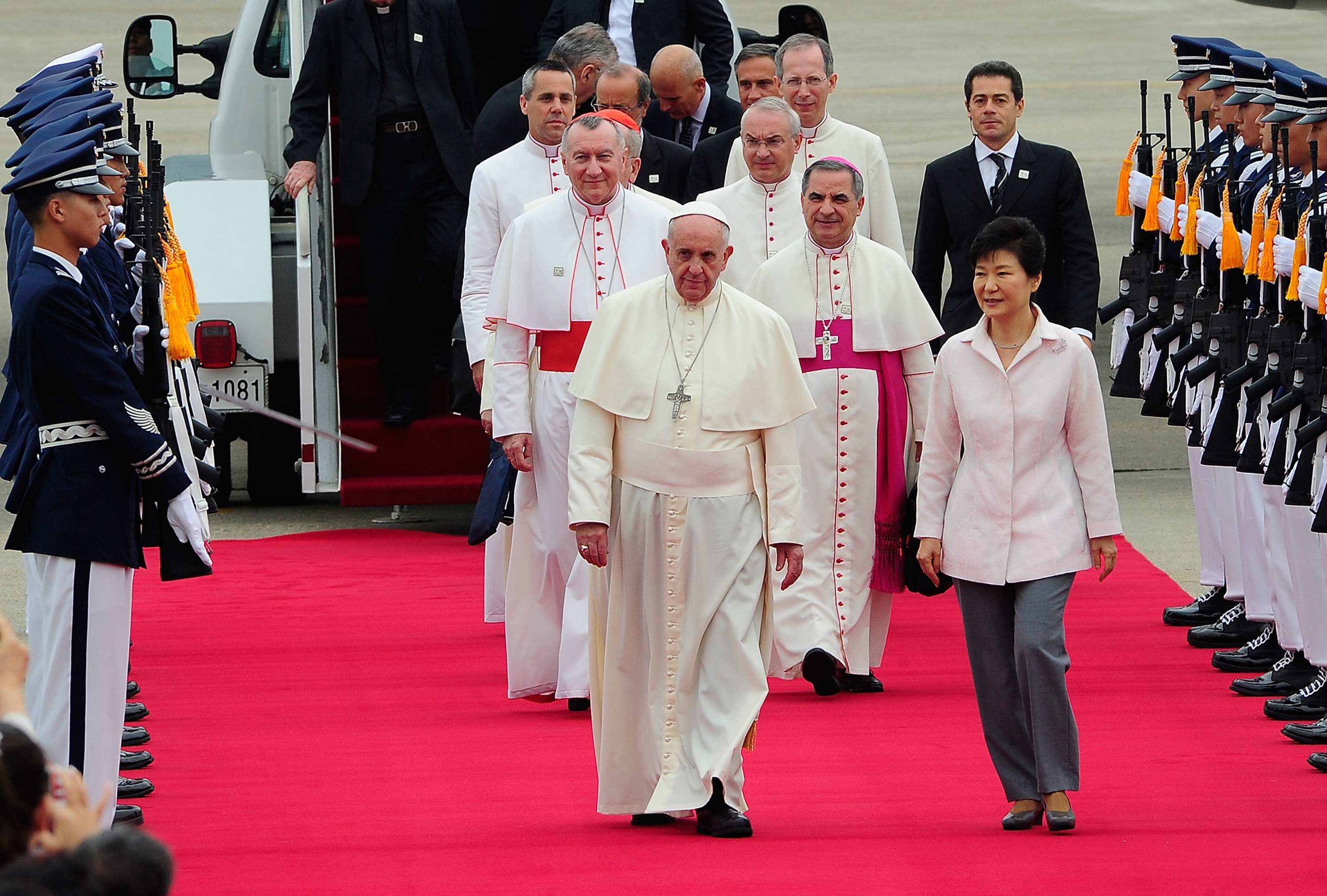 Pope Francis walks with South Korean President Park Geun-Hye upon his arrival on August 14, 2014 in Seoul, South Korea. (Pool—Getty Images)