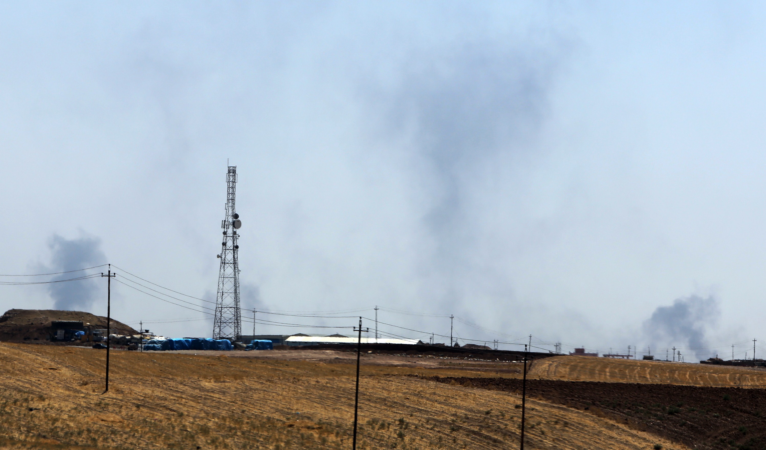 Smokes rises from U.S. air strikes near Mosul dam on Sunday. (Ahmad Al-Ruhbye—AFP/Getty Images)