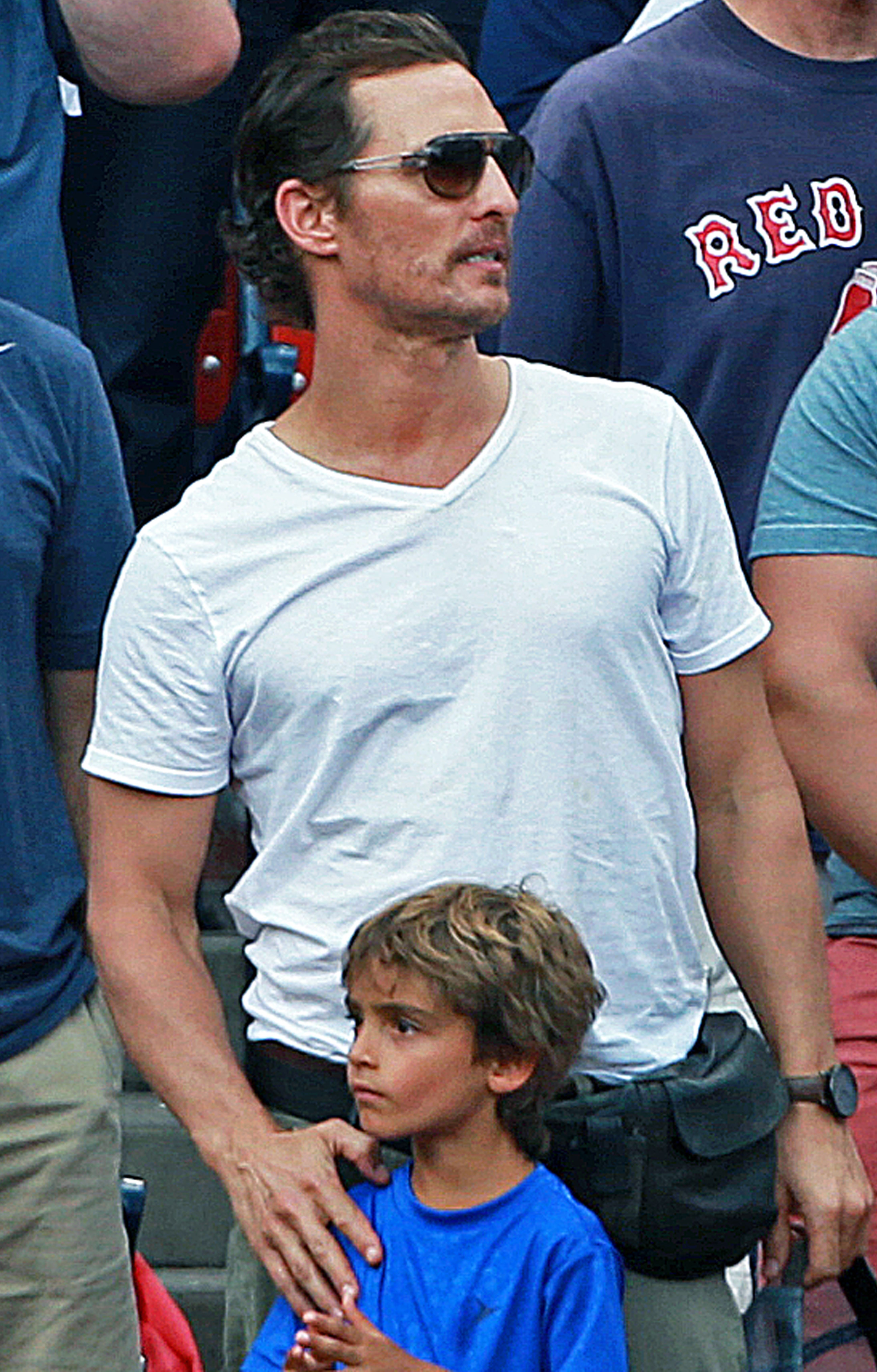 Actor Matthew McConaughey stands for the national anthem at the Red Sox game at Fenway Park on August 17, 2014. (Photo by Jim Davis/The Boston Globe via Getty Images) (Boston Globe—Boston Globe via Getty Images)