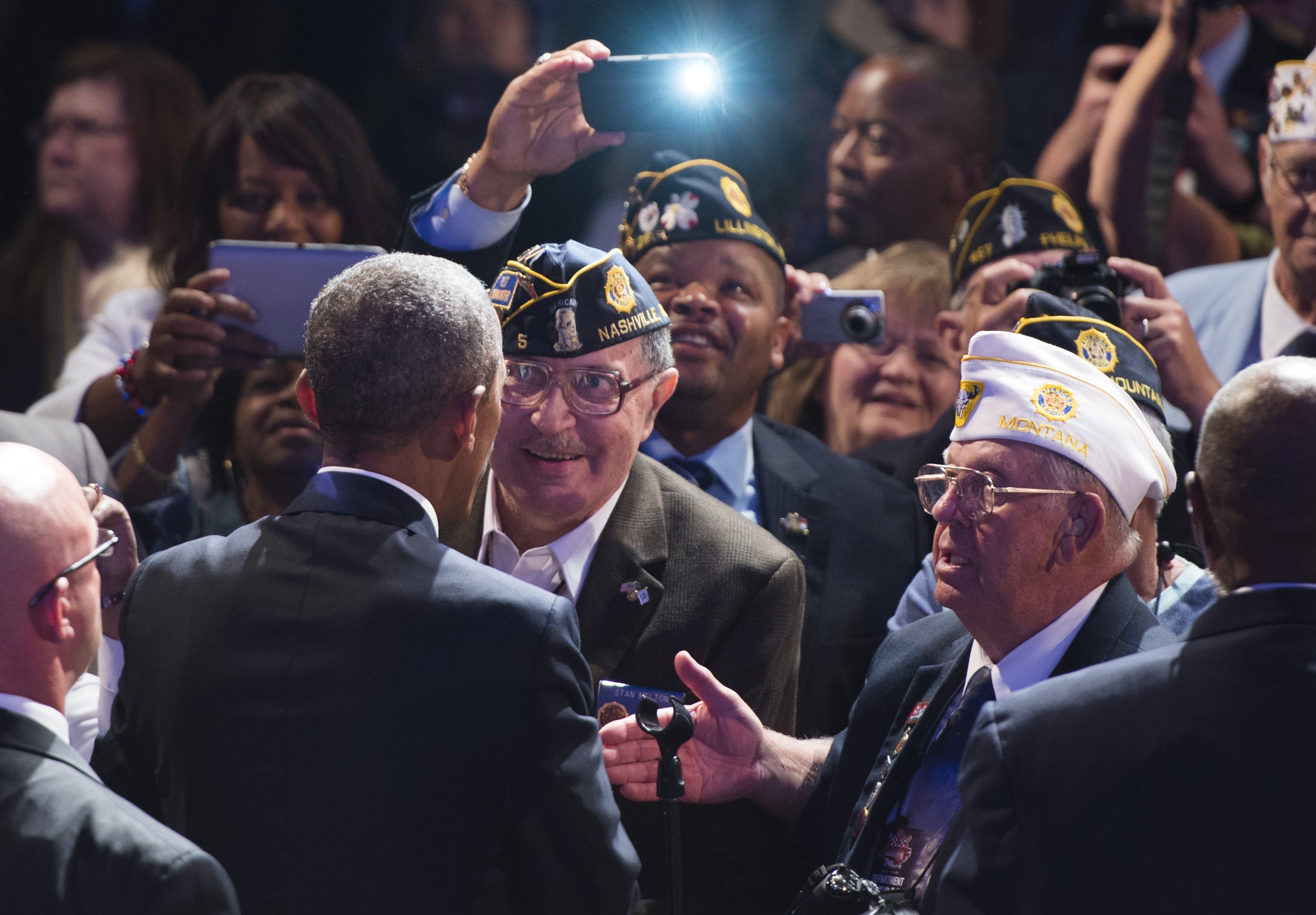 President Barack Obama greets members of the American Legion after speaking at the American Legion's 96th National Convention in Charlotte, North Carolina, August 26, 2014. (SAUL LOEB&mdash;AFP/Getty Images)