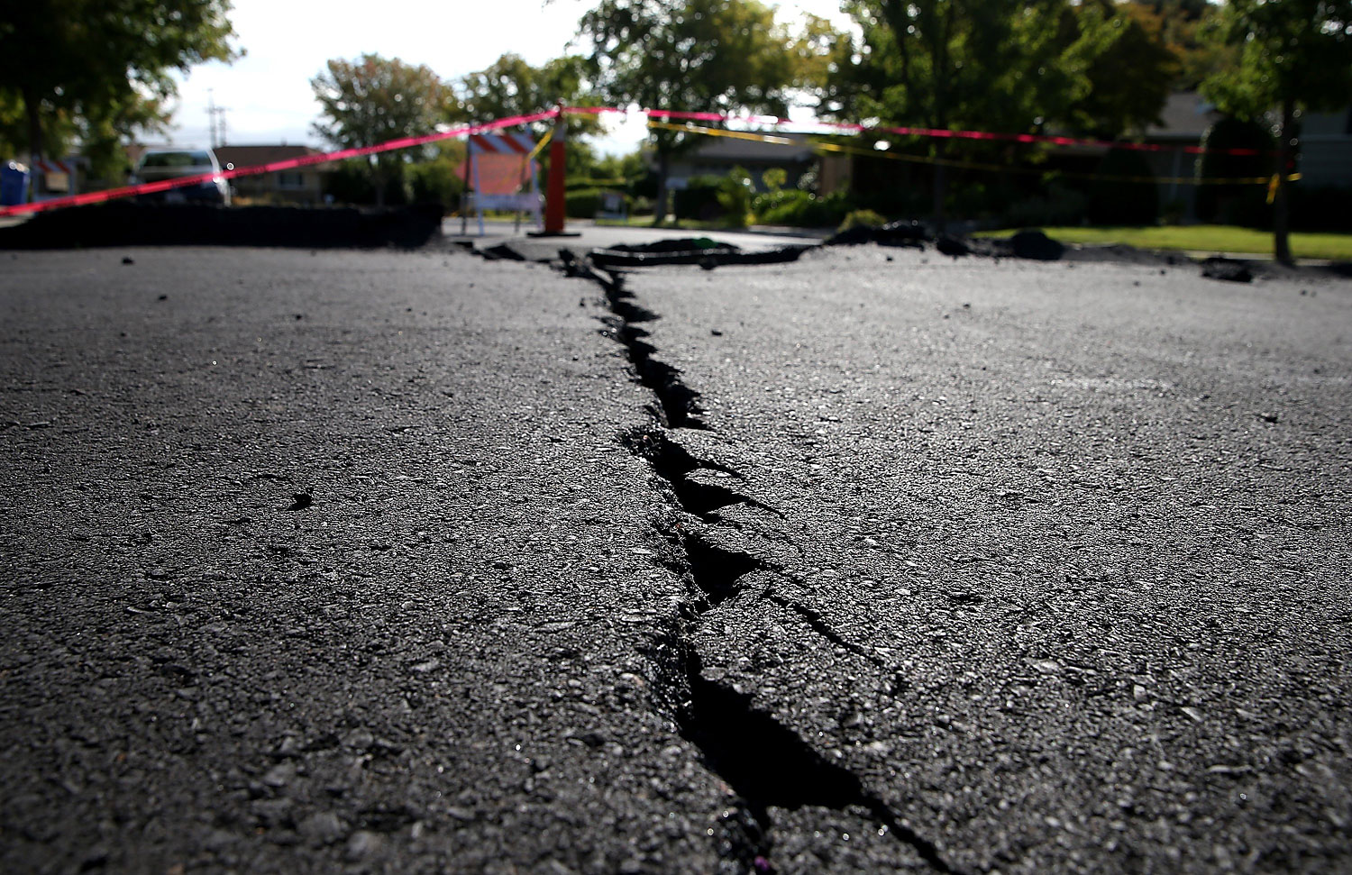 A crack runs down the center of an earthquake-damaged street in Napa, Calif., on Aug. 26, 2014 (Justin Sullivan—Getty Images)