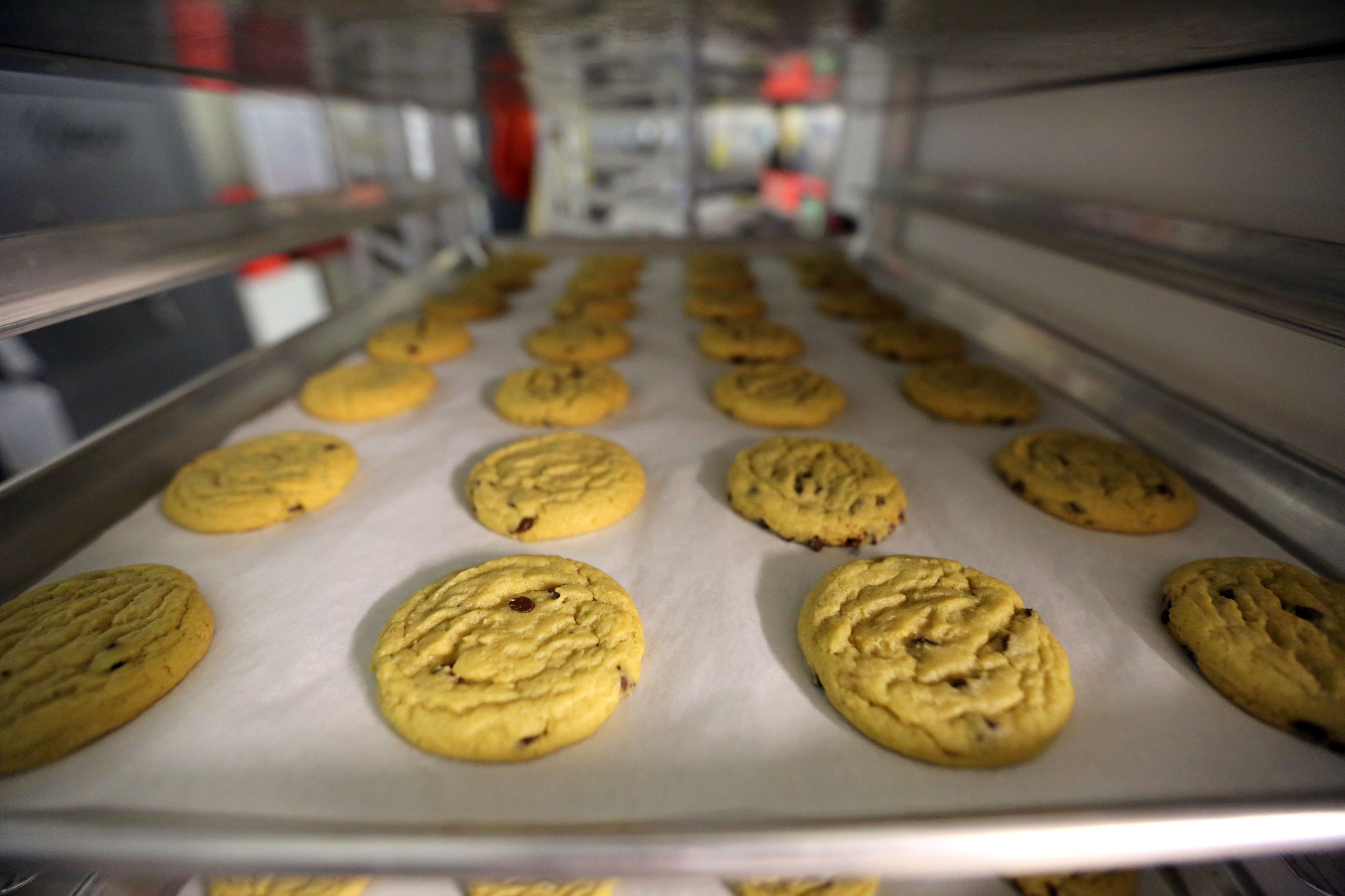 In this June 19, 2014 photo, freshly baked cannabis-infused cookies cool on a rack inside Sweet Grass Kitchen, a well-established gourmet marijuana edibles bakery which sells its confections to retail outlets, in Denver. (Brennan Linsley—ASSOCIATED PRESS)