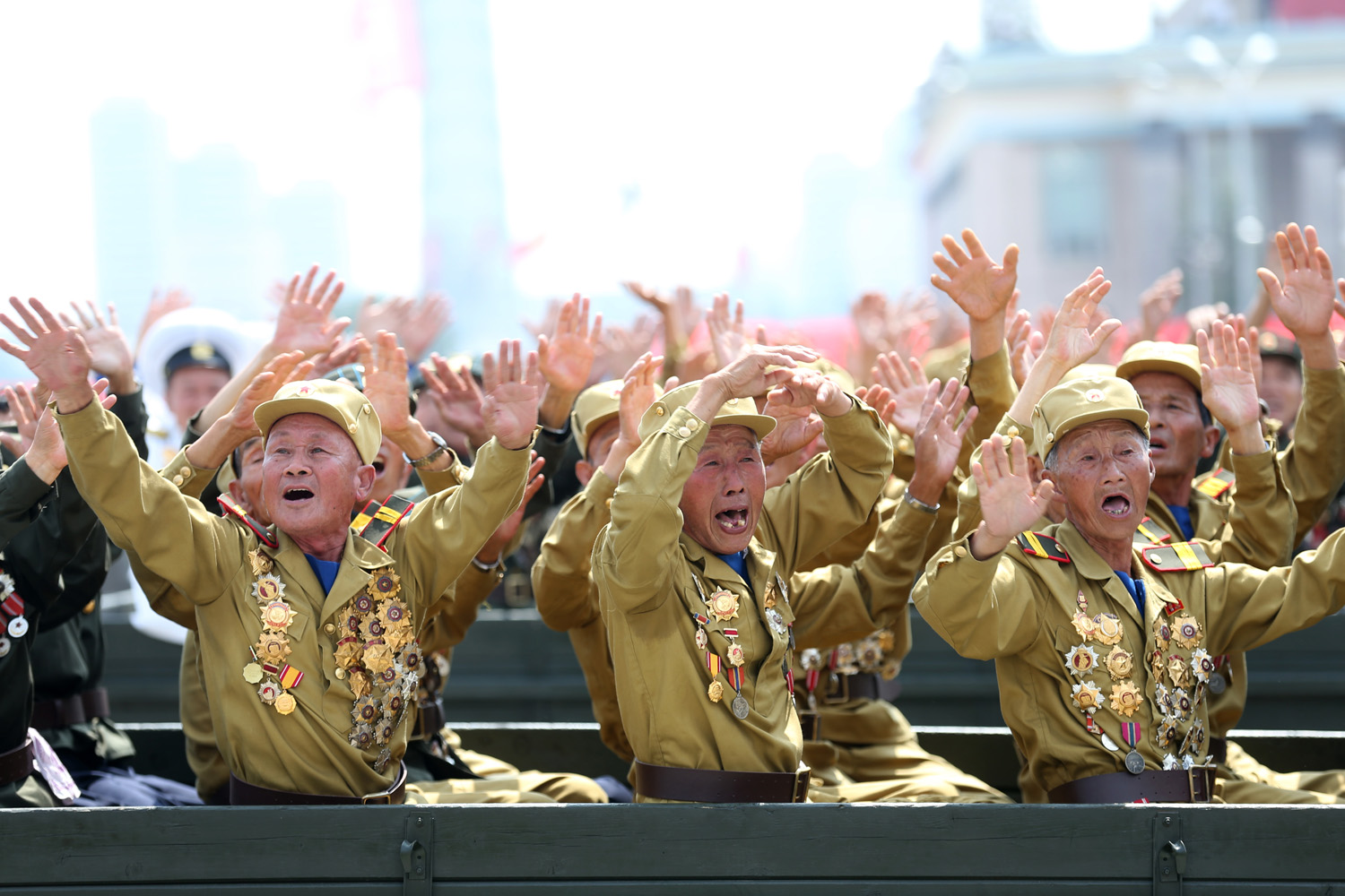 North Korean war veterans cry as they parade past their leader, Kim Jong Un, during the mass military parade celebrating the 60th anniversary of the Korean War armistice in Pyongyang, Jul. 23, 2014.