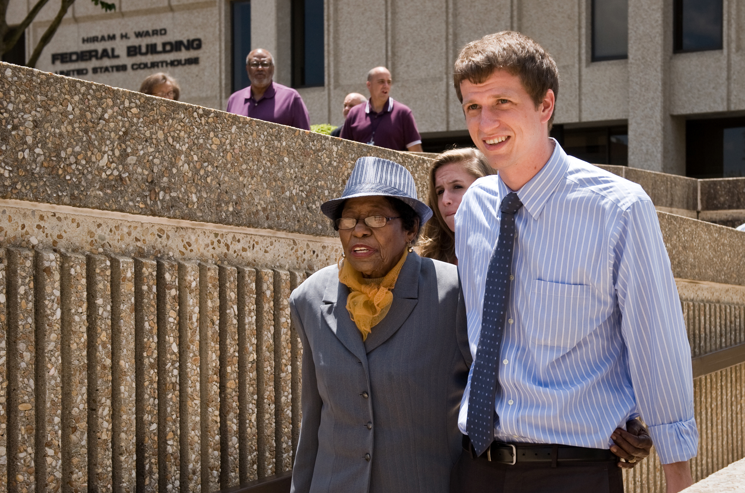 Rob Stephens, a field secretary with the North Carolina NAACP, escorts Rosanell Eaton, a plaintiff in the lawsuit challenging the new North Carolina voting law, out of the Ward Federal building during lunch recess on Monday, July 7, 2014 in Winston-Salem, N.C.  The U.S. Justice Department is asking a federal judge in North Carolina to put sweeping changes to the state's voting laws on hold through the November election. The Justice Department argues the Republican-backed measures are designed to suppress turnout at the polls among minorities, the elderly and college students. (Andrew Dye—AP)