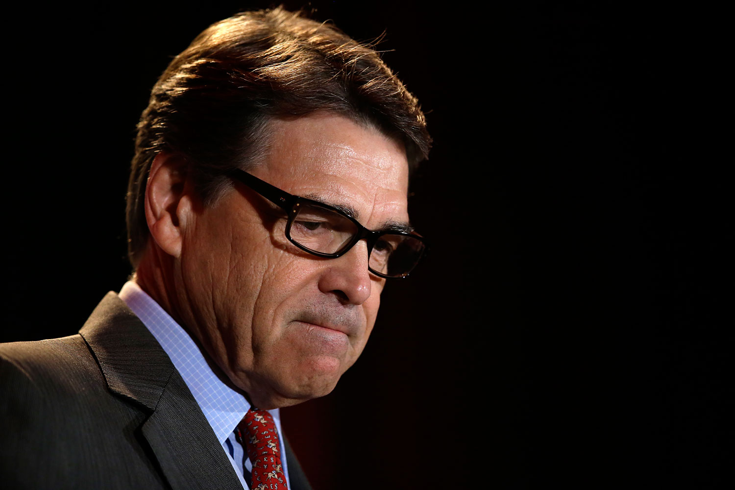 Governor Rick Perry pauses as he addresses attendees at the 2014 Red State Gathering, Aug. 8, 2014, in Fort Worth, Texas. (Tony Gutierrez—AP)