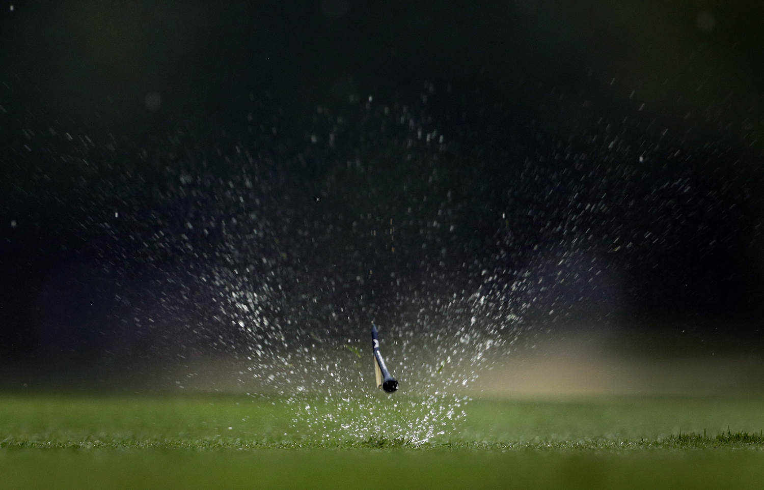 Aug. 8, 2014. Ryan Palmer's golf tee flies through the rain soaked grass on the 12th hole during the second round of the PGA Championship golf tournament at Valhalla Golf Club in Louisville, Ky.
