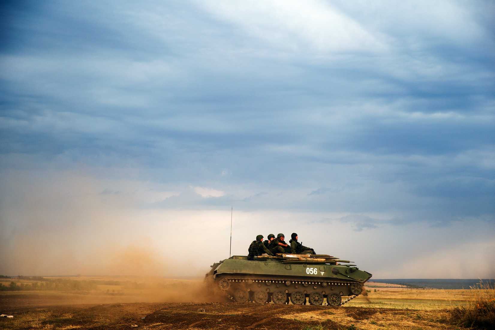 A Russian APC moves in a field in about 10 kilometers (6.2 miles) from the Russia-Ukrainian border control point at Russian town of Donetsk, Rostov-on-Don region on Aug. 18, 2014. (Pavel Golovkin—AP)
