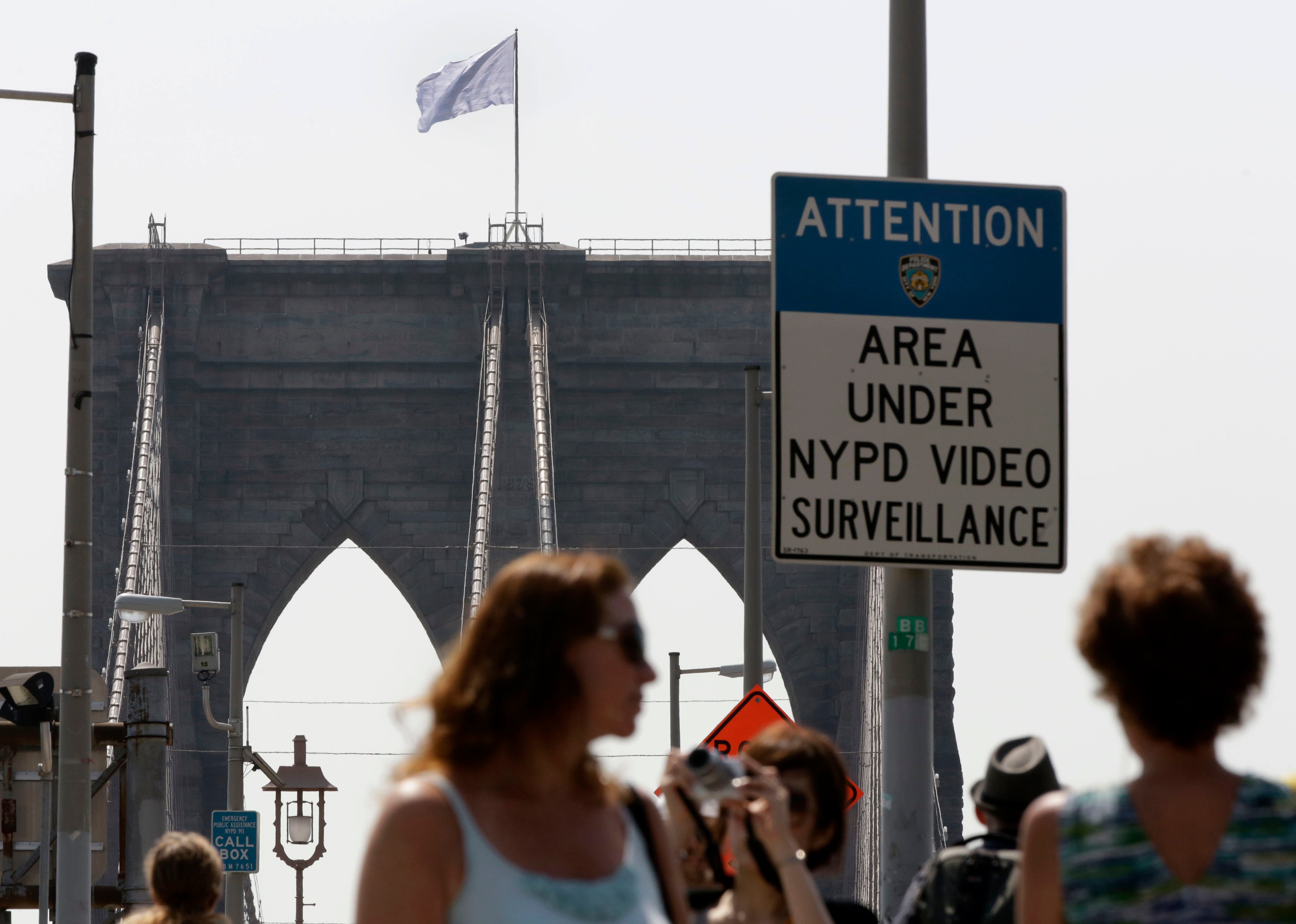 A white flag flies atop the west tower of the Brooklyn Bridge, in New York City, on July 22, 2014 (Richard Drew—AP)