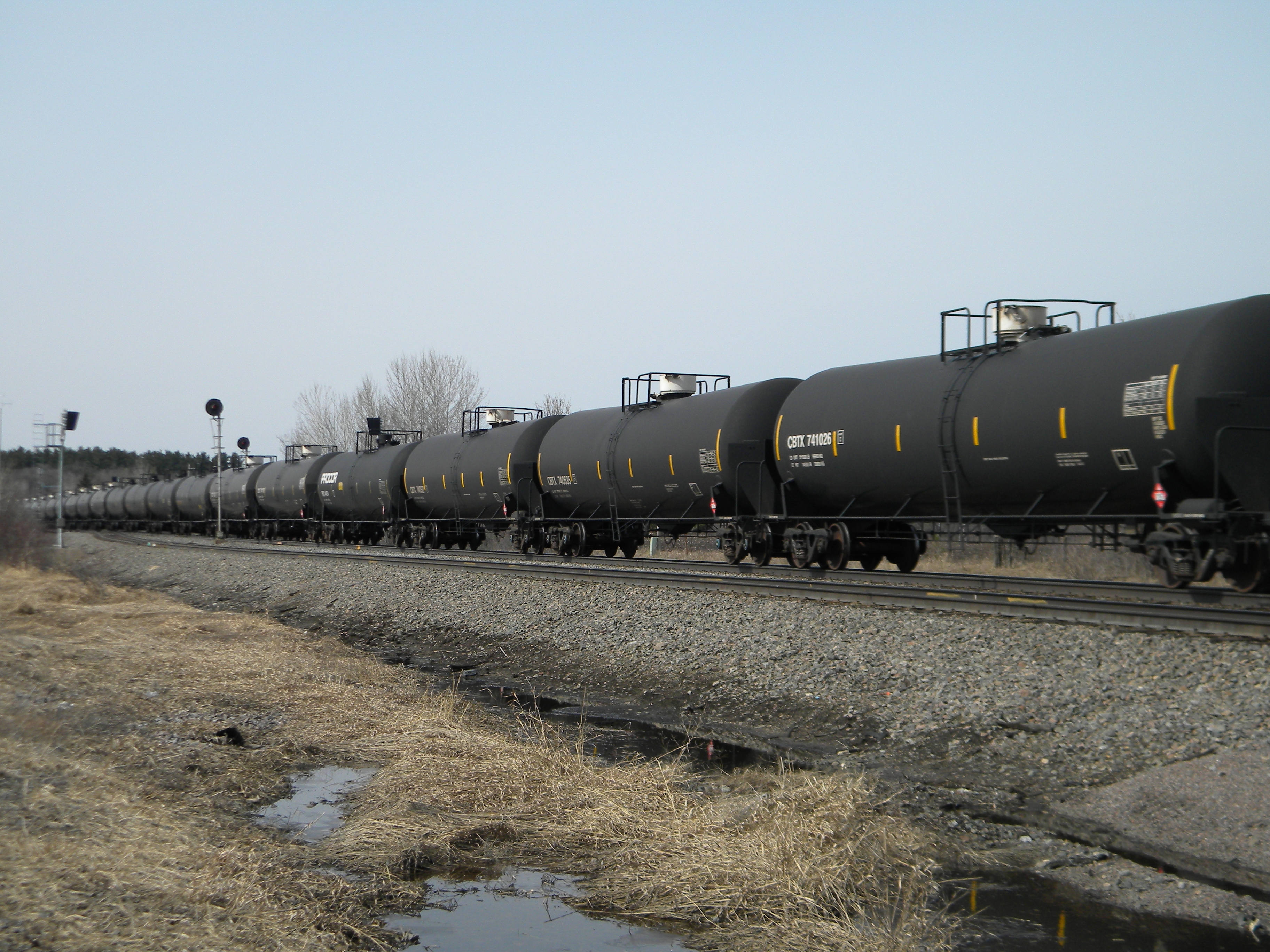 An oil-tank train with crude oil from the Bakken shale fields of North Dakota travels near Staples, Minn., on April 15, 2014 (Mike Cronin—AP)