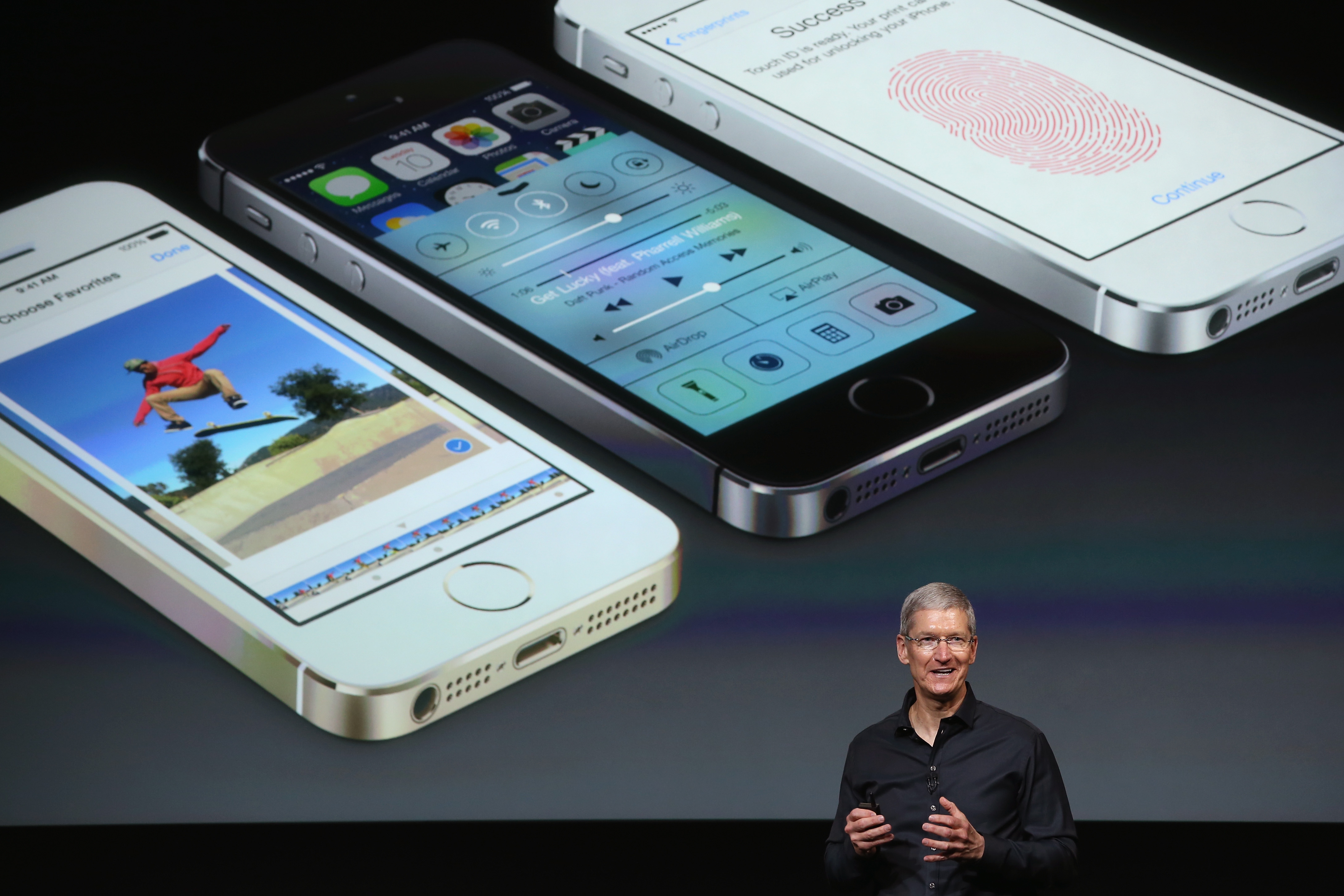 Apple CEO Tim Cook speaks about the new iPhone during an Apple product announcement at the Apple campus on September 10, 2013 in Cupertino, California.