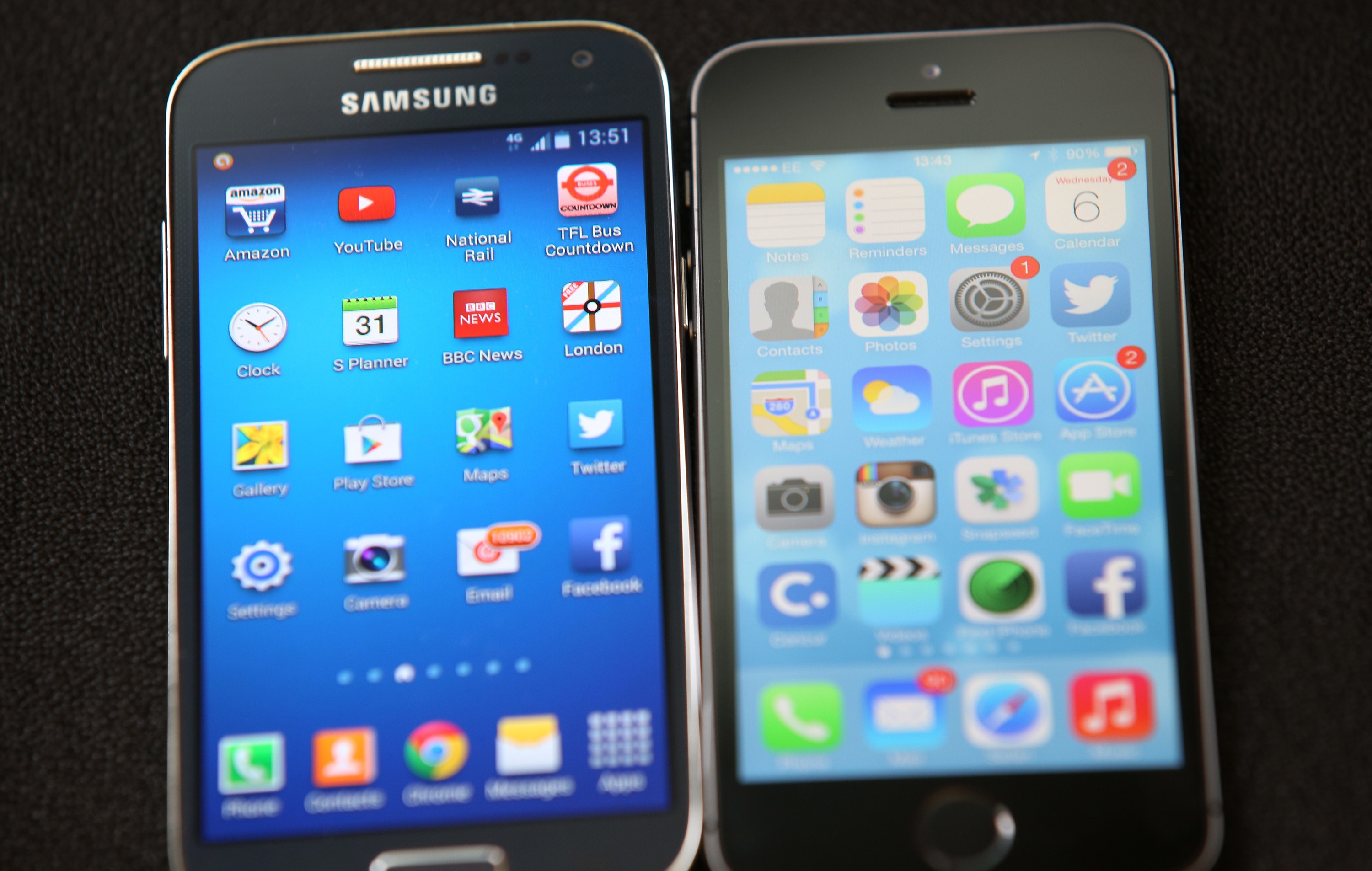 A Samsung and Apple smartphone are displayed in London on Aug. 6, 2014 (Peter Macdiarmid—Getty Images)