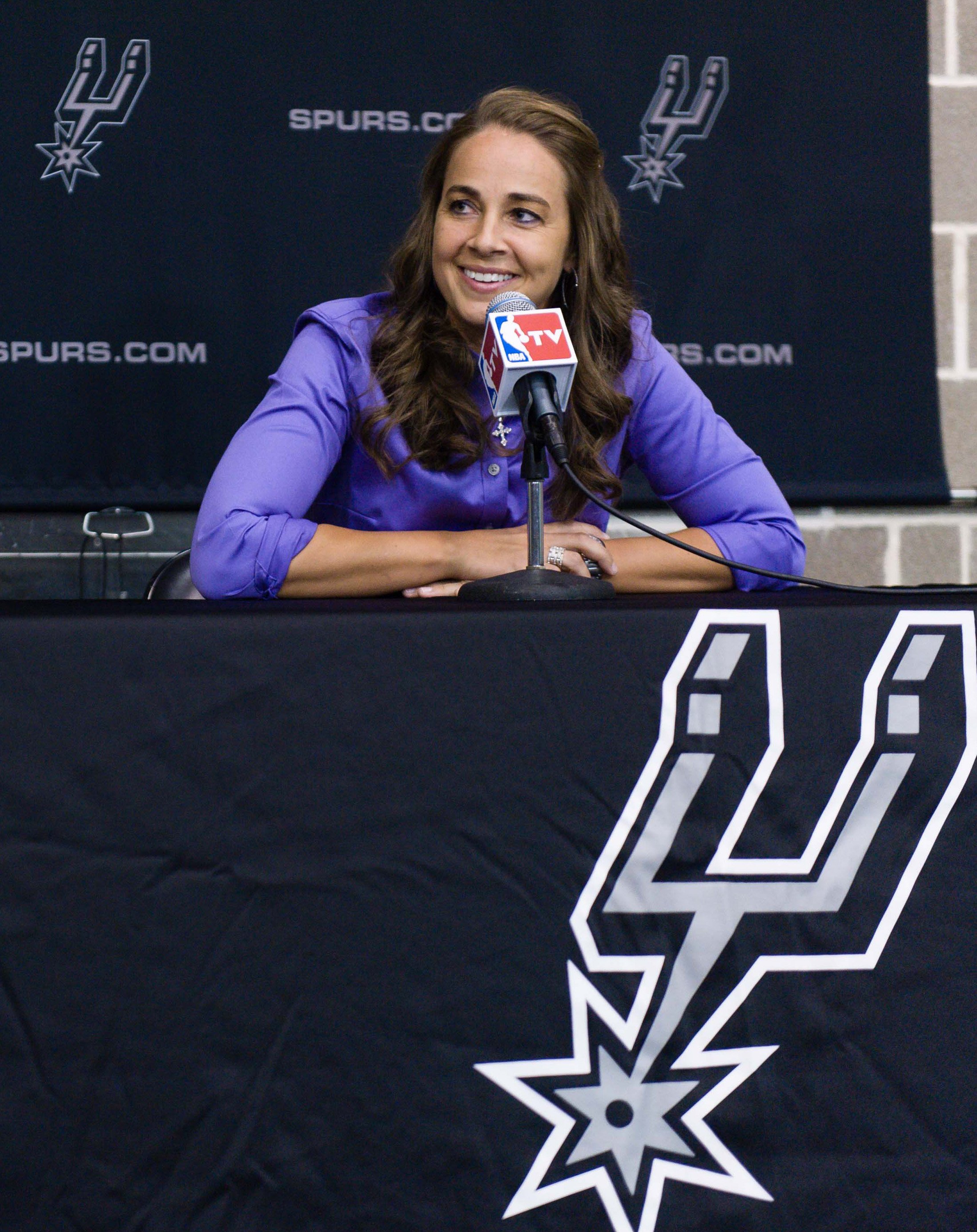 WNBA star Becky Hammon takes questions from the media at the San Antonio Spurs practice facility after being introduced as an assistant coach with the team on Tuesday, Aug. 5, 2014 in San Antonio. 