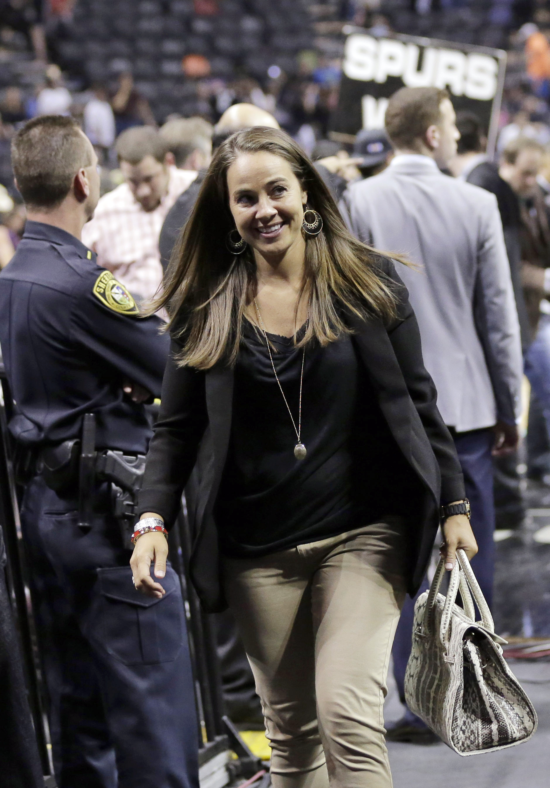 San Antonio Stars' Becky Hammon walks off the court following Game 5 of the opening-round NBA basketball playoff series between the San Antonio Spurs and the Dallas Mavericks in San Antonio on April 30, 2014