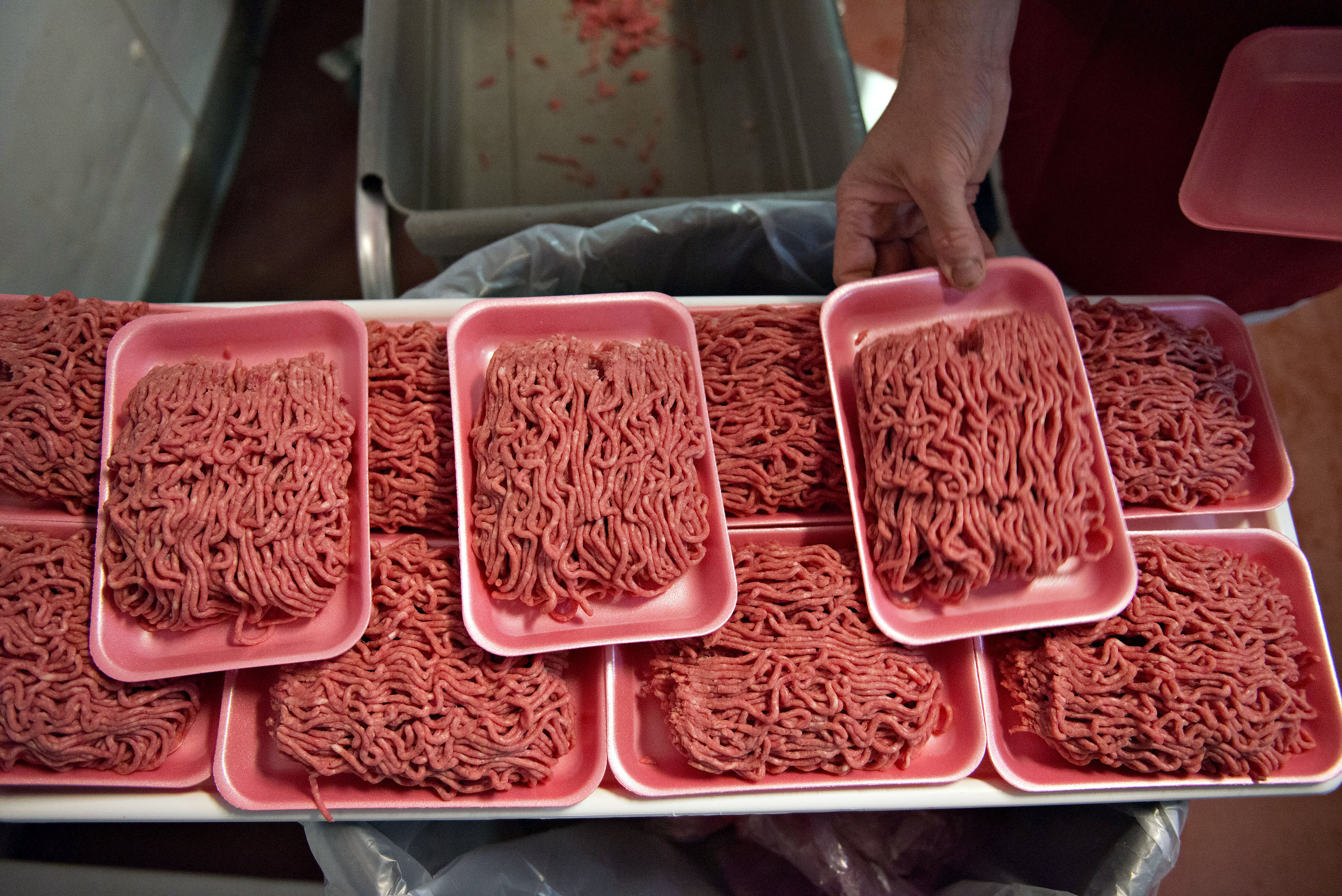 Ground beef is portioned onto trays at a supermarket meat department, July 2, 2014. (Daniel Acker—Bloomberg/Getty Images)