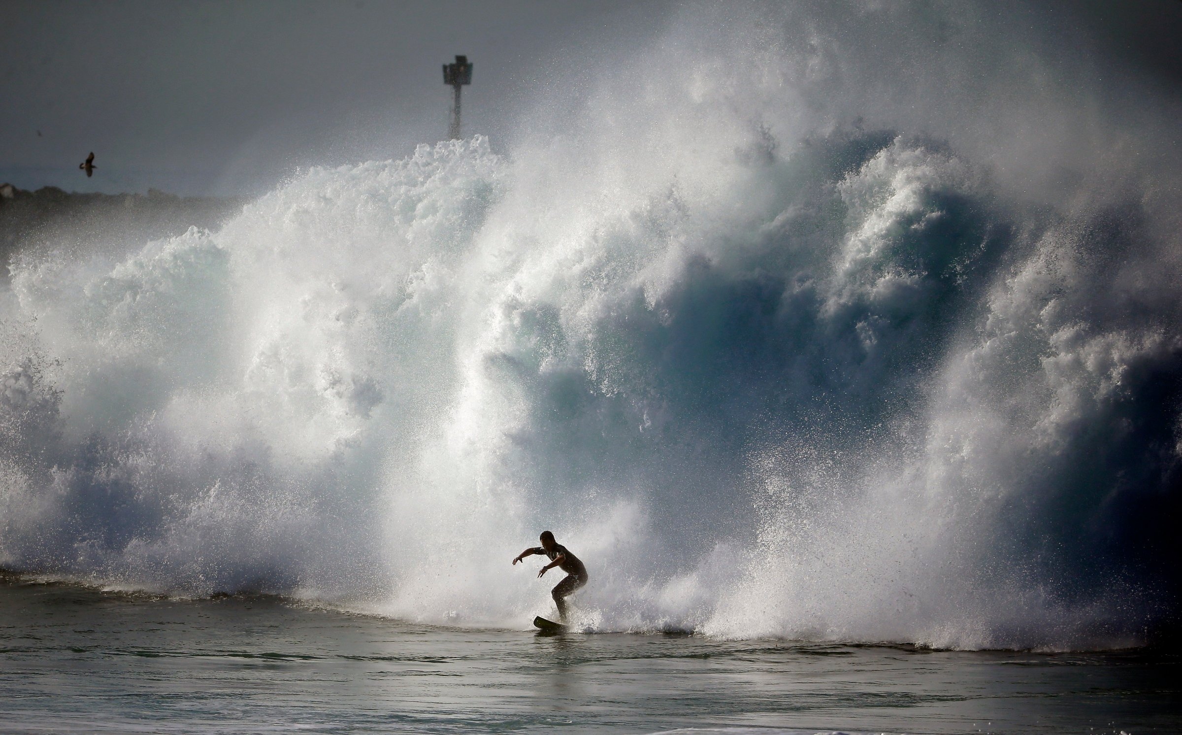 A surfer rides a wave at the wedge in Newport Beach, Calif. on Aug. 27, 2014. Southern California beachgoers experienced much higher than normal surf, brought on by Hurricane Marie spinning off the coast of Mexico.
