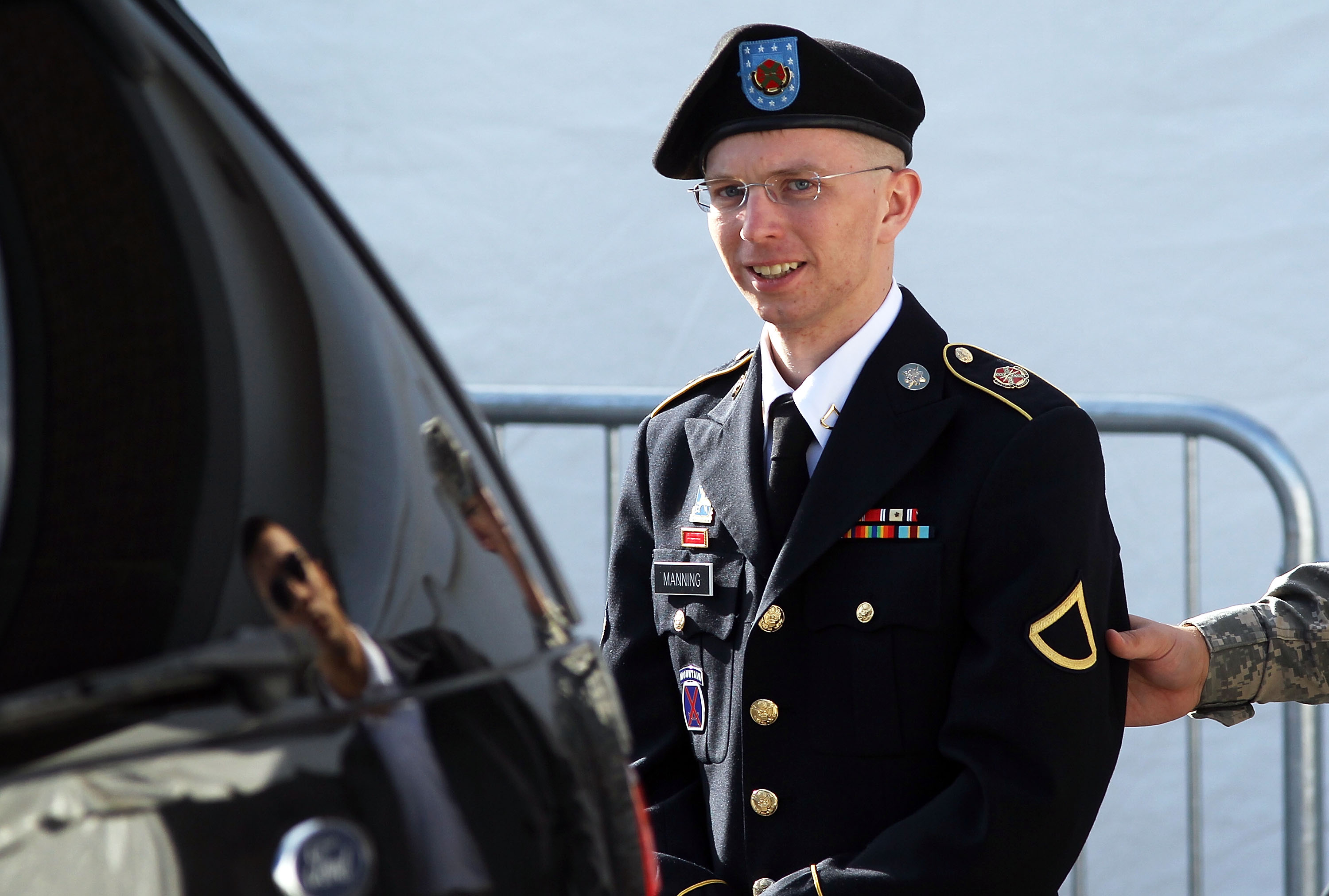 U.S. Army Private Bradley Manning is escorted as he leaves a military court at the end of the first of a three-day motion hearing June 6, 2012 in Fort Meade, Maryland. (Alex Wong—Getty Images)