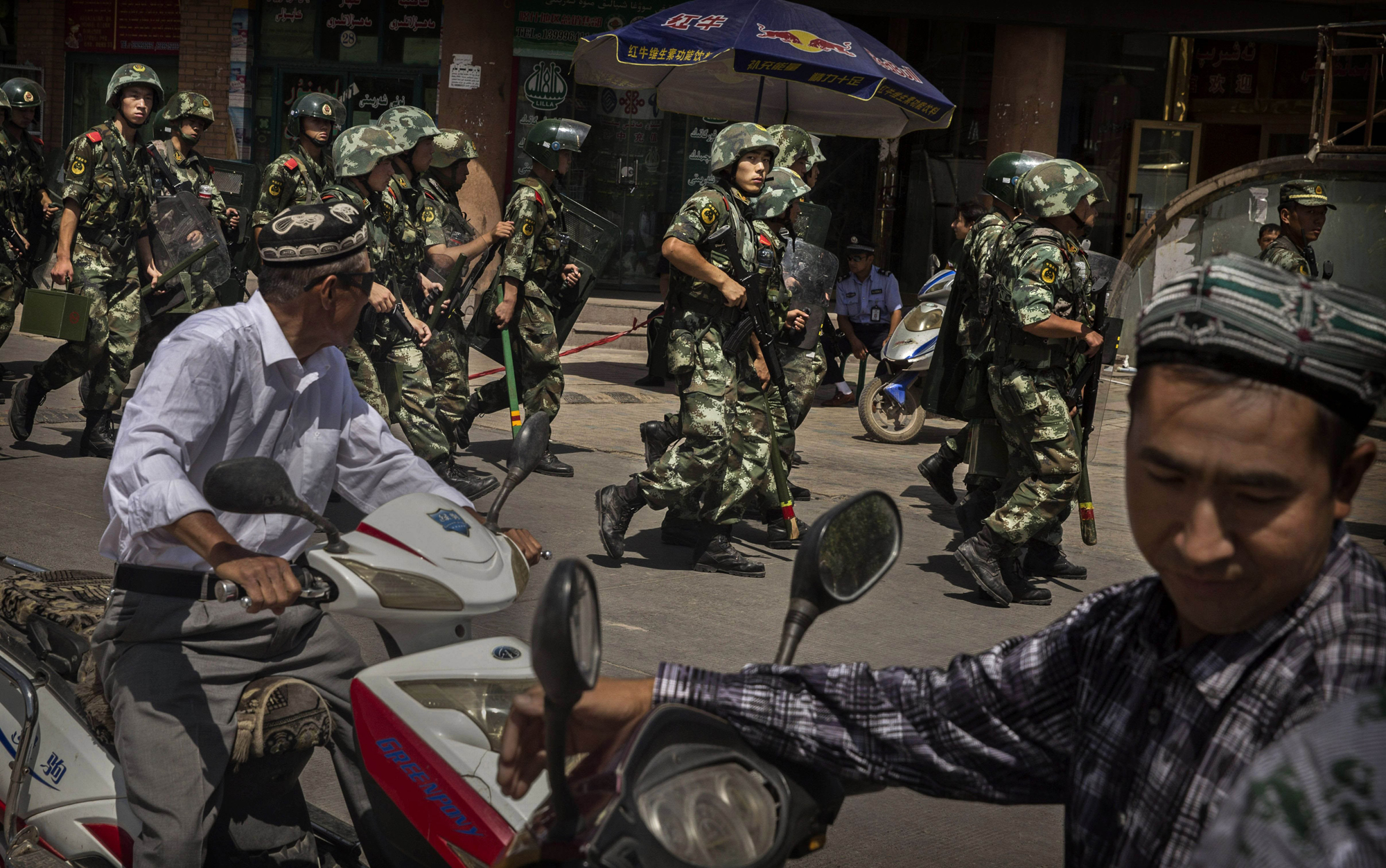 Chinese soldiers patrol in Kashgar, in Xinjiang Uighur Autonomous Region, on July 30, 2014 (Kevin Frayer—Getty Images)