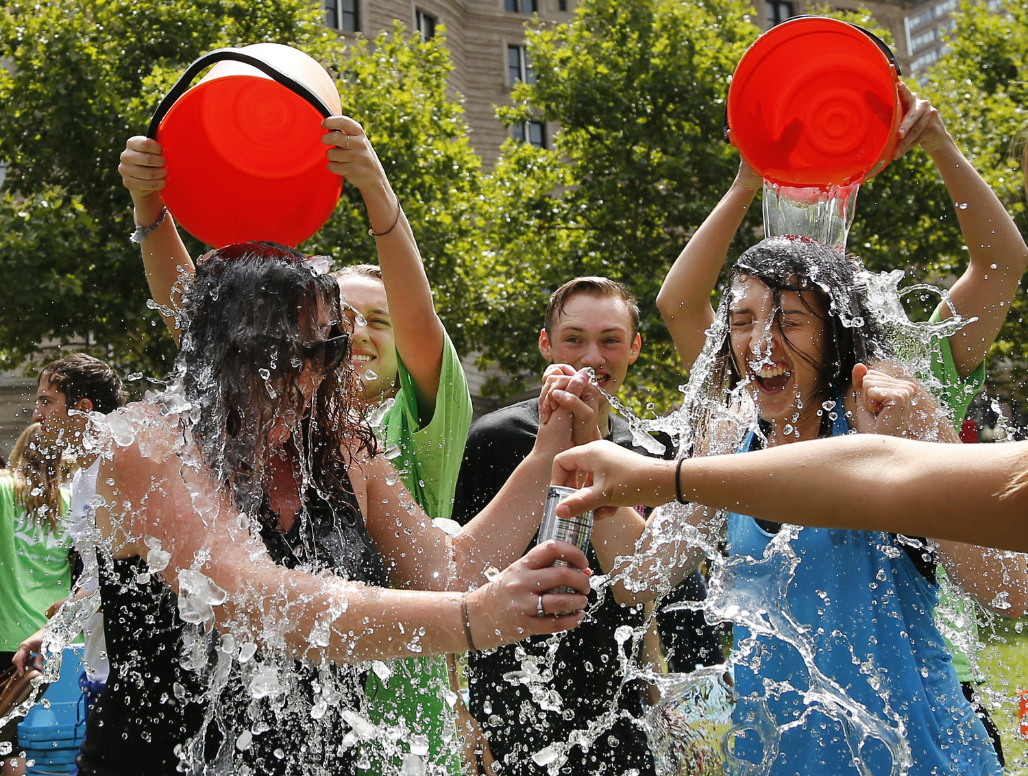 Two women get doused during the ice bucket challenge at Boston's Copley Square on Aug. 7, 2014. (Elise Amendola—AP)