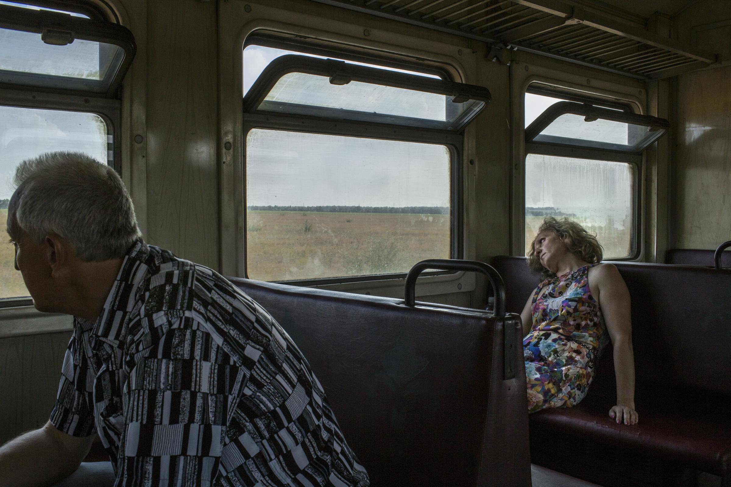 Passengers during a train trip from the village of Alchevsk towards Luhansk, Ukraine on August 13, 2014.