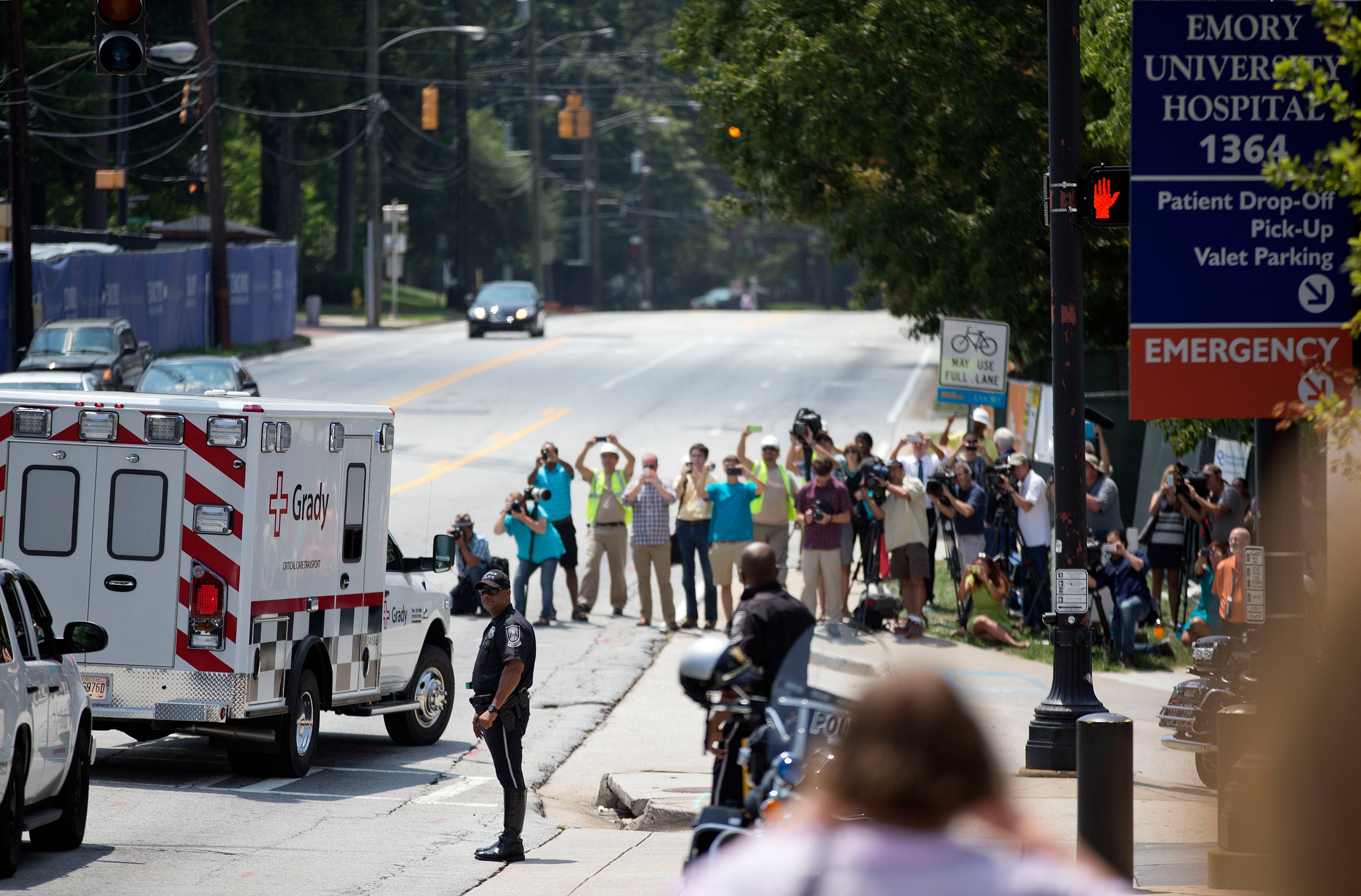 An ambulance transporting Nancy Writebol, an American missionary stricken with Ebola, arrives at Emory University Hospital, Tuesday, Aug. 5, 2014, in Atlanta. (David Goldman—AP)