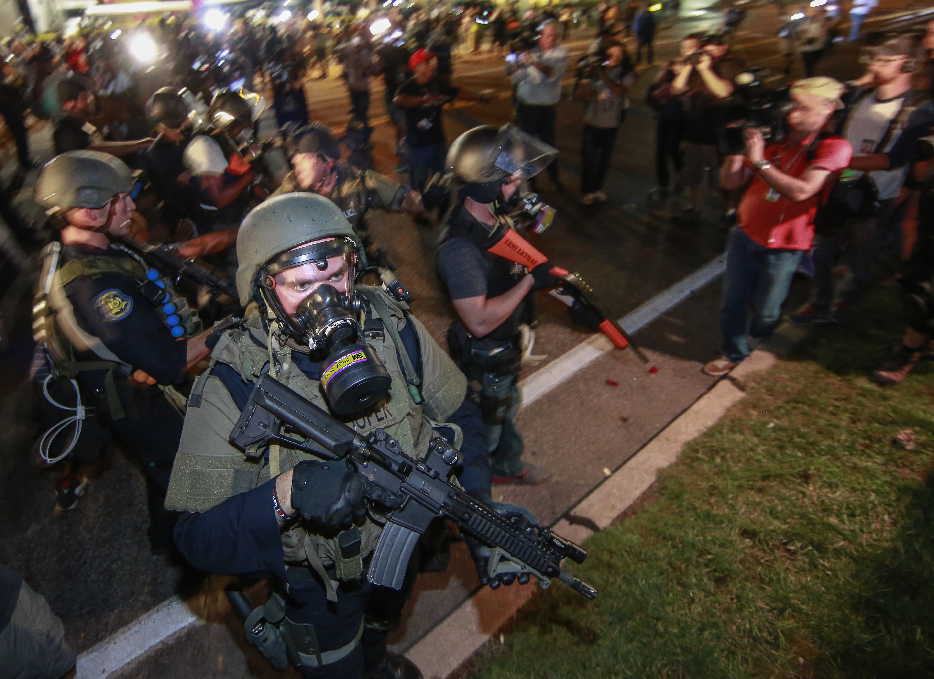 Law enforcement officers watch on during a protest on August 18, 2014 for Michael Brown, who was killed by a police officer on August 9 in Ferguson, United States. (Anadolu Agency—Getty Images)
