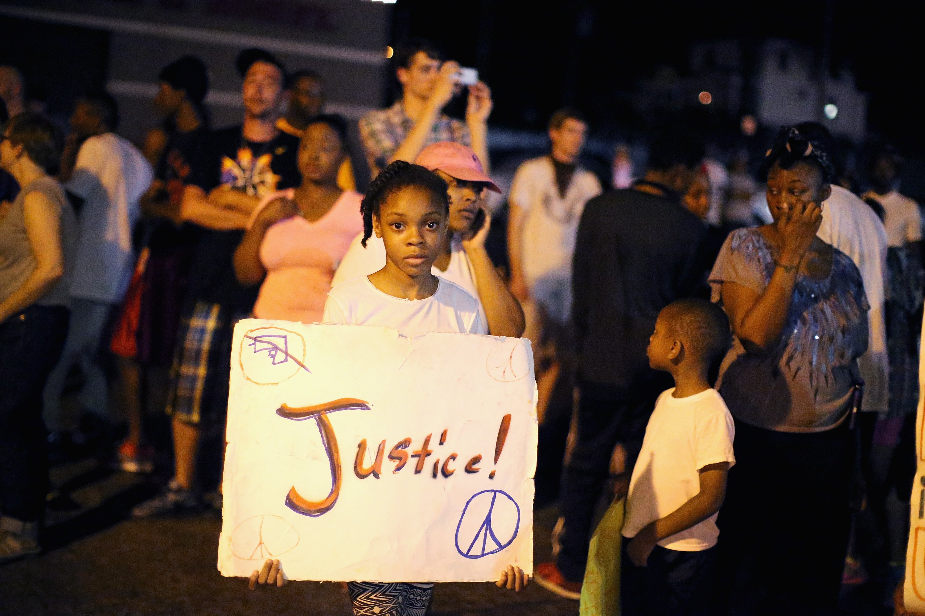Demonstrators protest the death of Michael Brown on Aug. 22, 2014 in Ferguson, Mo. (Scott Olson—Getty Images)