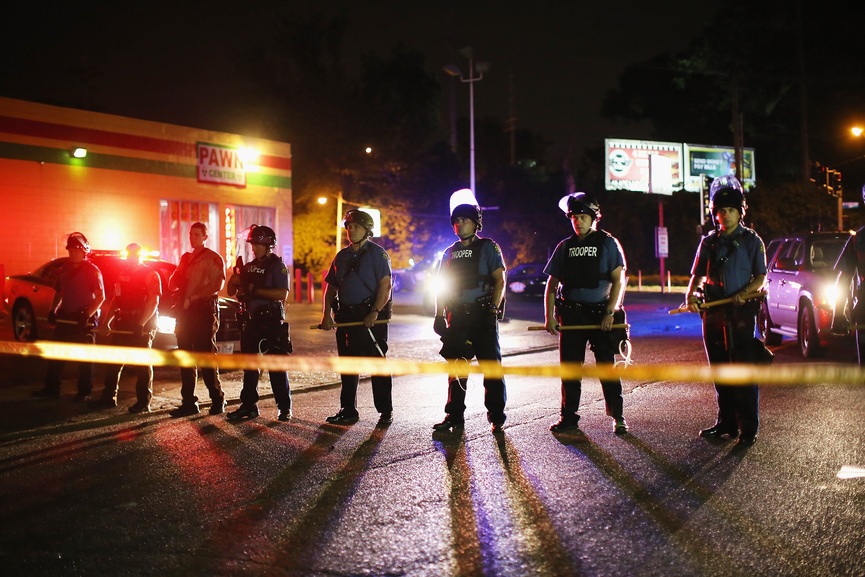 Riot police lock down a neighborhood in Ferguson, Mo. on Aug. 11, 2014. (Scott Olson—Getty Images)