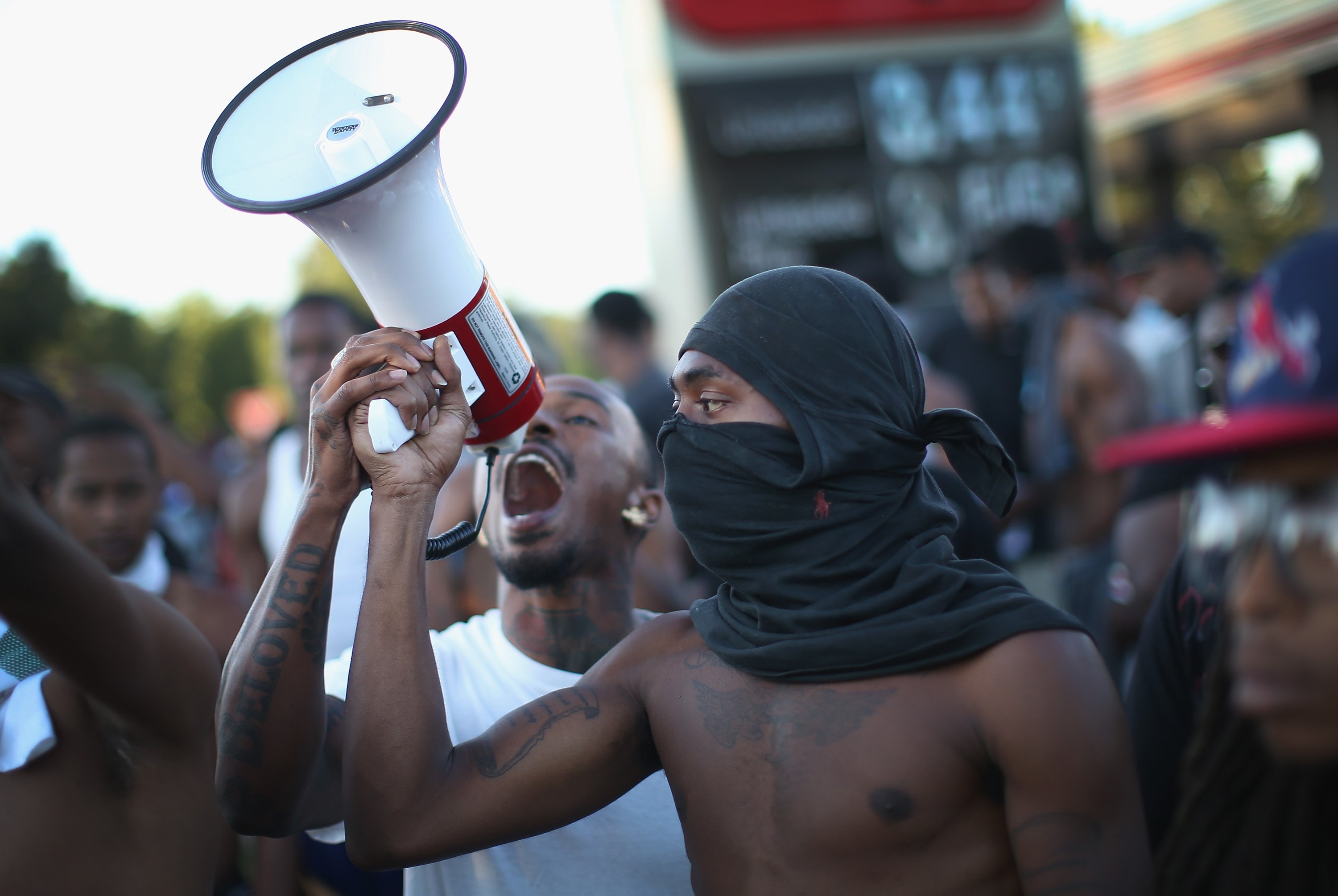 Demonstrators protest the killing of teenager Michael Brown in Ferguson, Mo. on August 12, 2014.