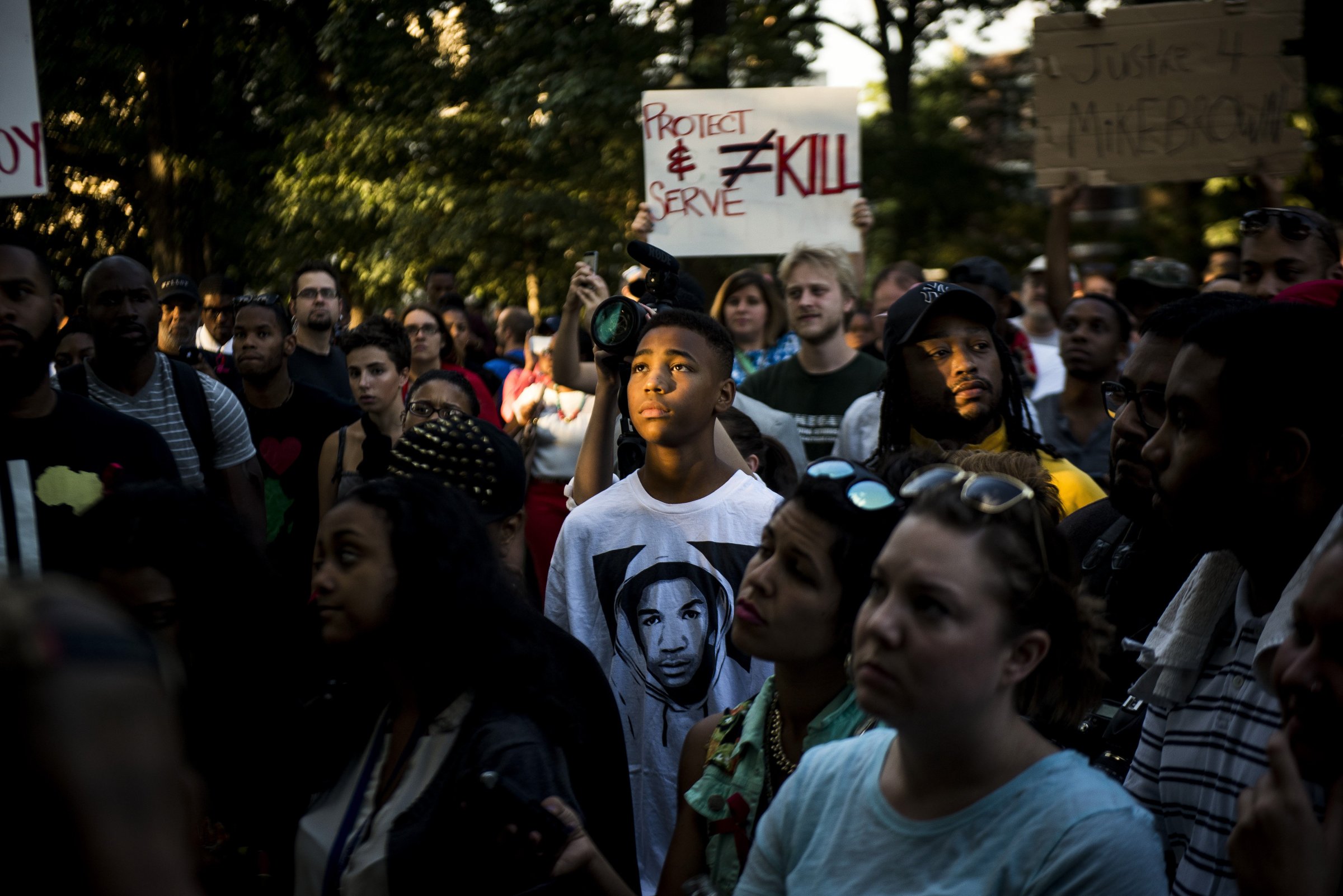 A demonstrator wearing a Trayvon Martin T-shirt stands with others in Washington D.C. to express solidarity with protesters in Ferguson, Mo.