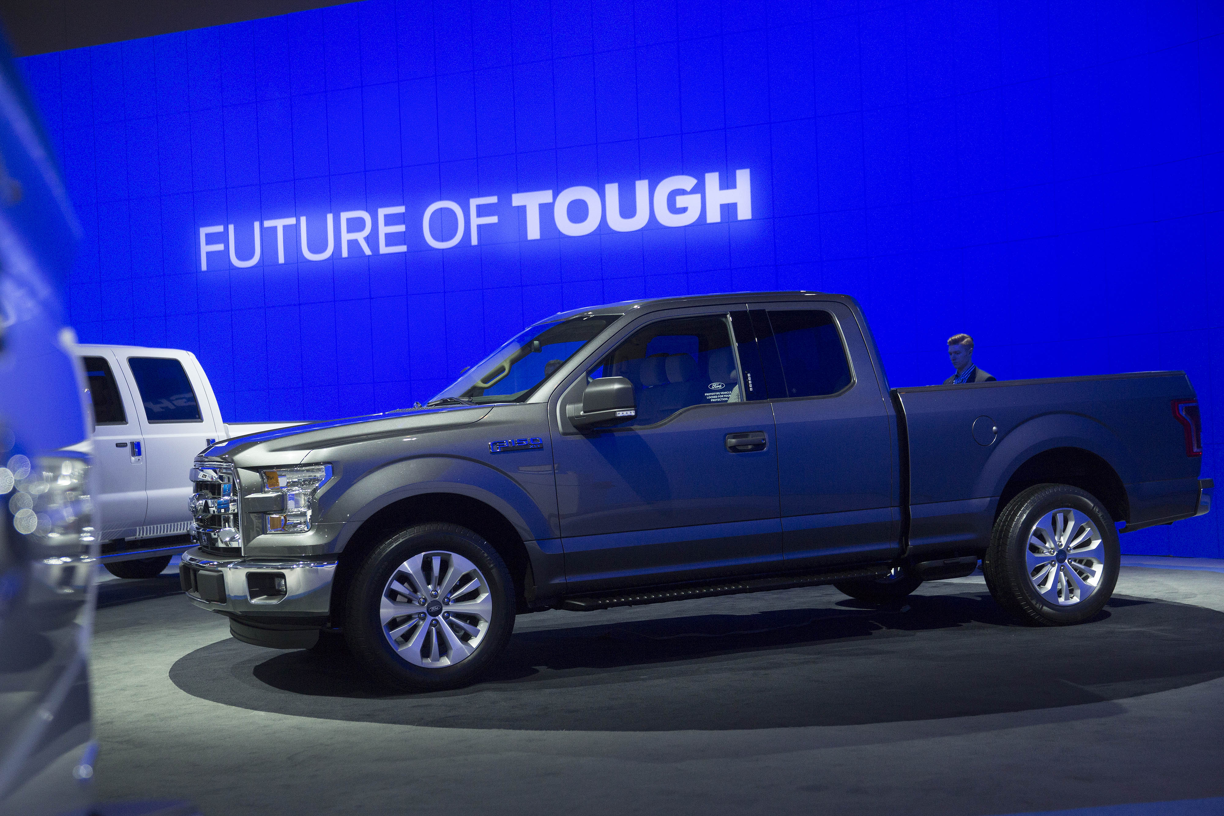 An attendee looks at the Ford Motor Co. F-150 pickup truck during the Washington Auto Show in Washington, D.C., U.S., on Wednesday, Jan. 22, 2014. (Bloomberg via Getty Images)