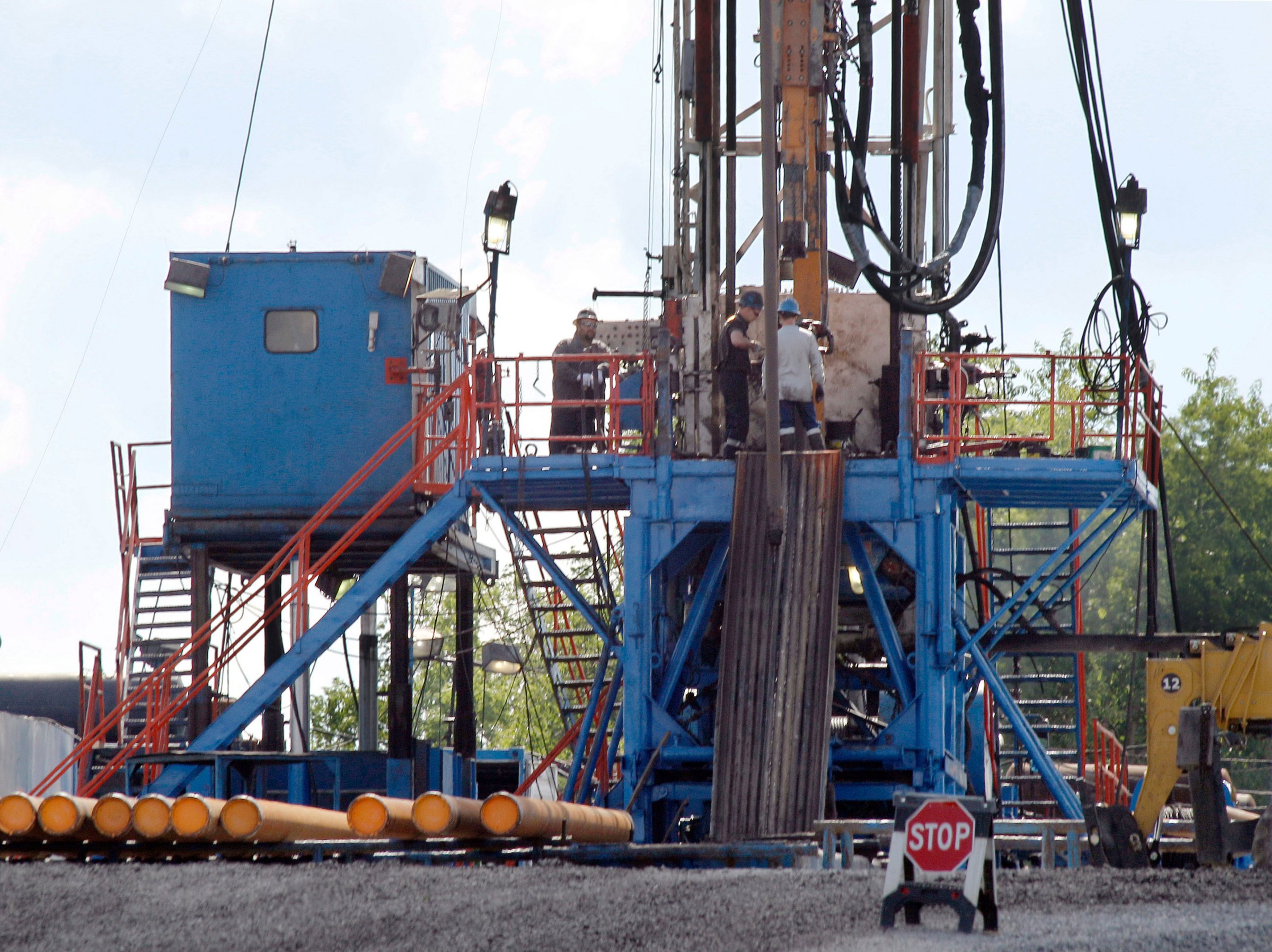 A crew works on a gas drilling rig at a well site for shale based natural gas in Zelienople, Pa on Feb. 28. 2013.