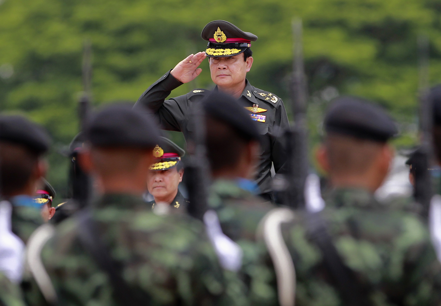 Thailand's newly appointed Prime Minister Chan-ocha reviews honor guards during his visit at the 2nd Infantry Battalion, 21st Infantry Regiment, Queen's Guard in Chonburi province, on the outskirts of Bangkok