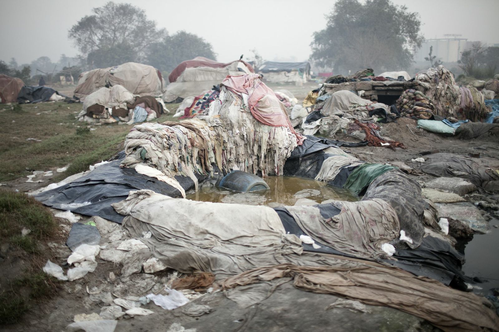 A makeshift laundry area for nearby hotels is seen along the Yamuna river, a tributary of the Ganges, Feb, 2014.